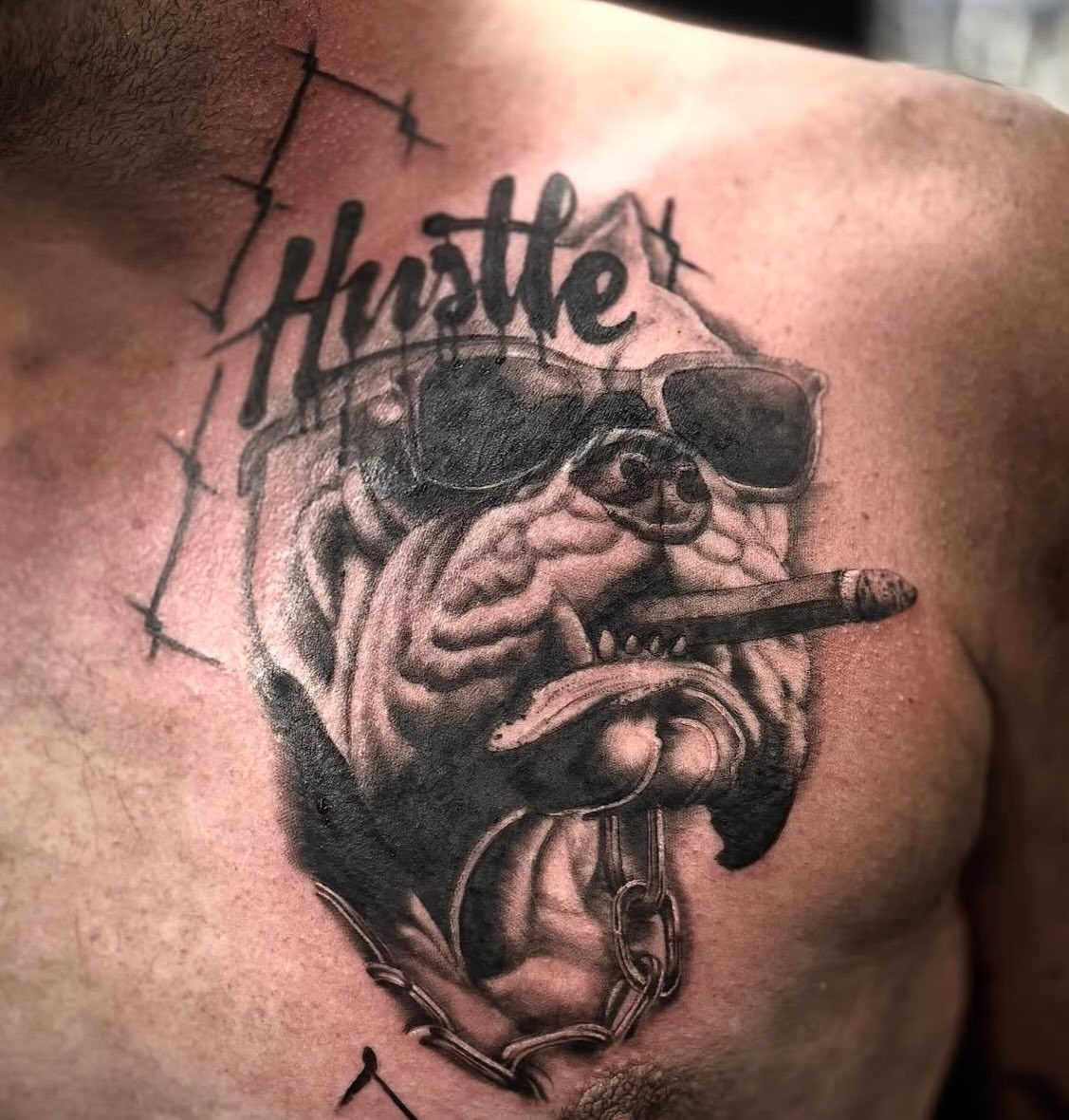 Bulldog smoking cigar realism tattoo on the chest by Boise Tattoo Artist