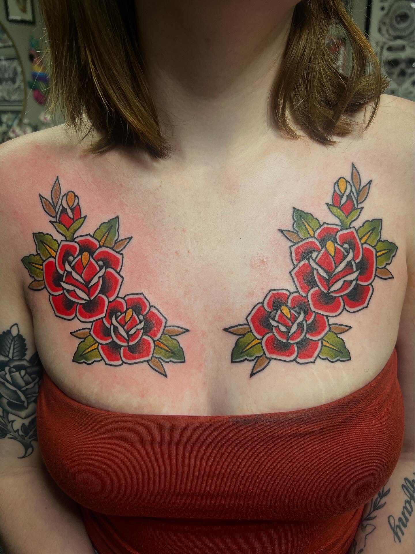 Roses American traditional tattoo on the chest by Taylor Estrella