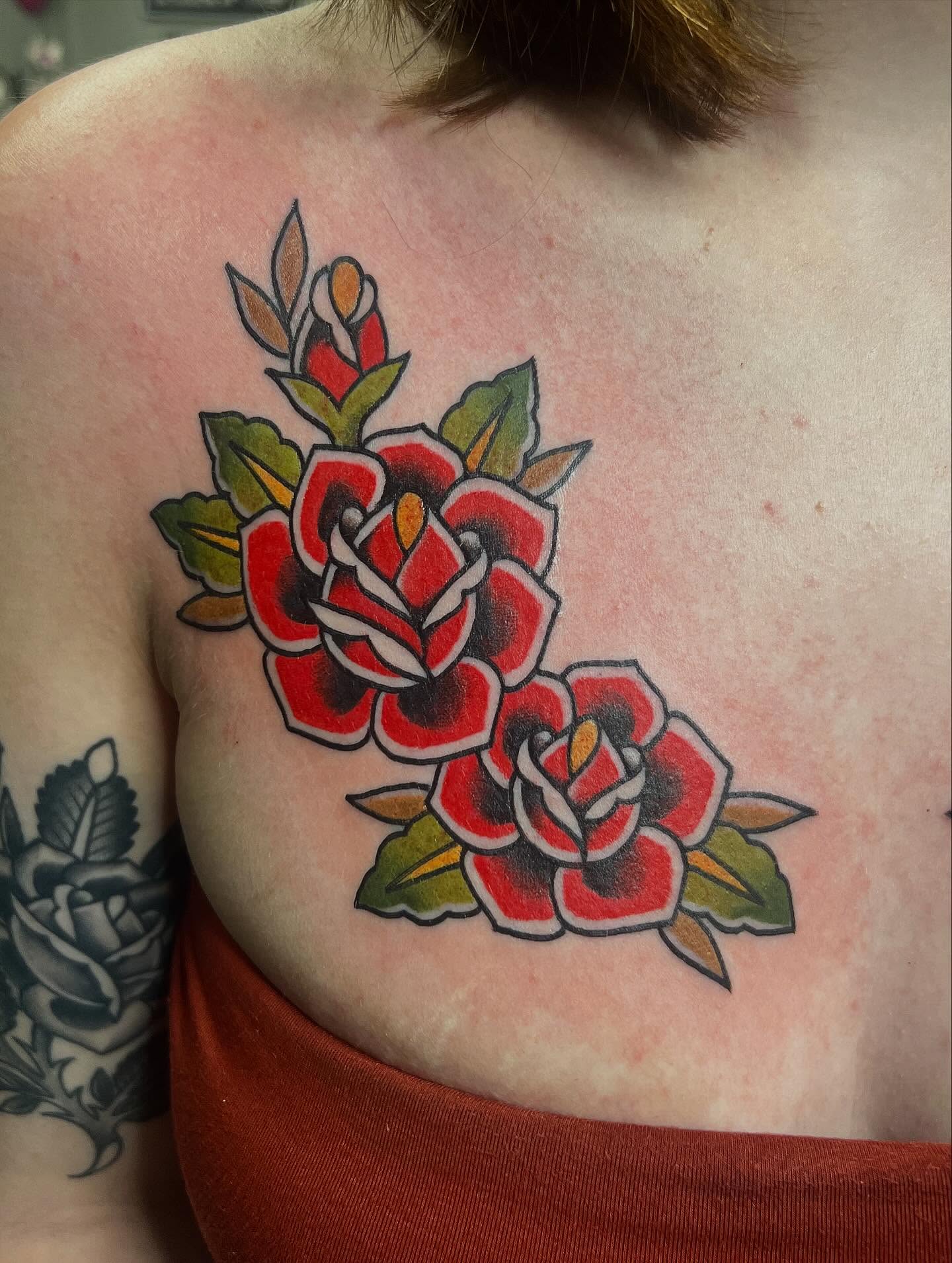 Roses American traditional tattoo on the shoulder by Taylor Estrella