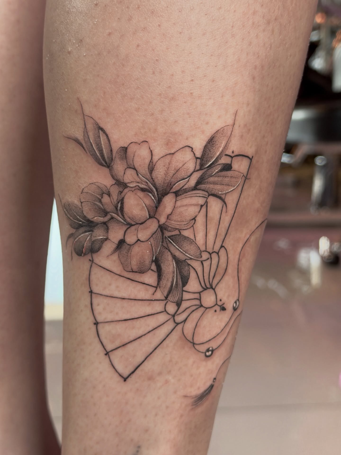 Flower bouquet black and grey tattoo on the leg by Vu Nguyen