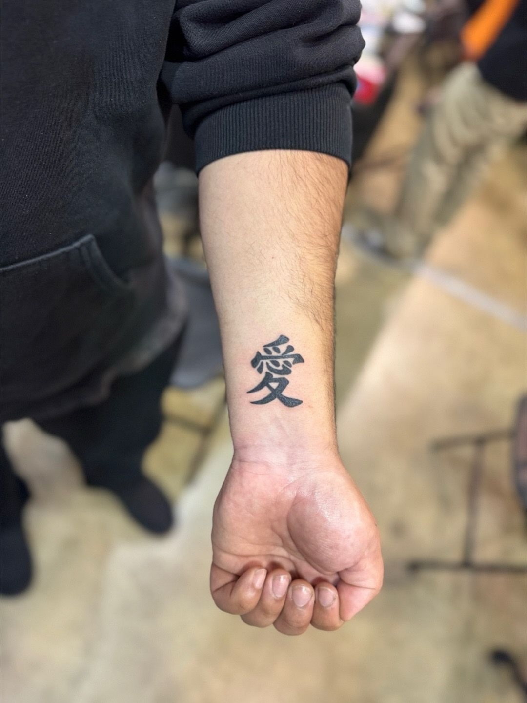 Kanji character black and grey tattoo on the forearm by North County Sd