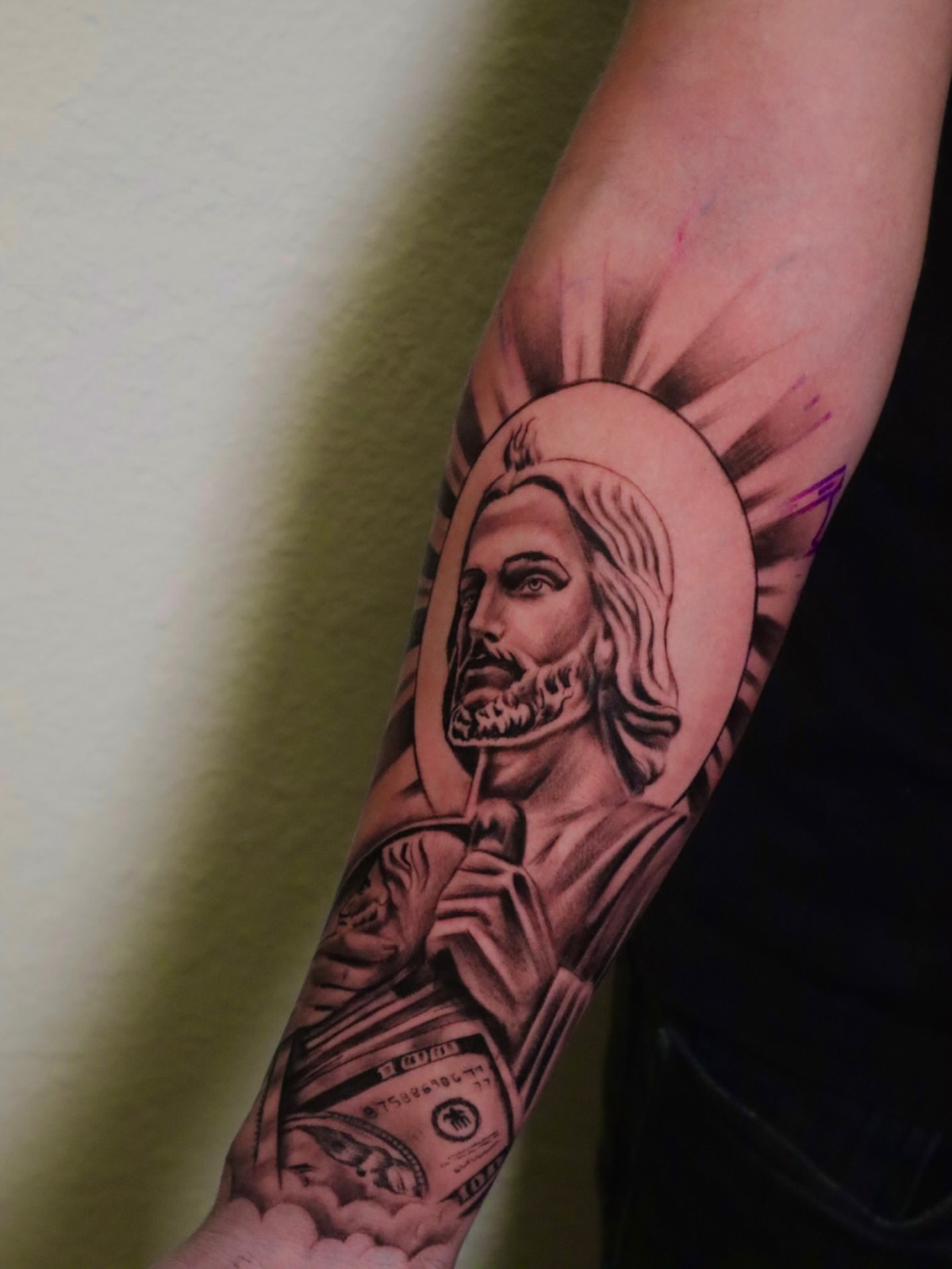 Religious figure black and grey tattoo on the forearm by Mr Letters🗡️