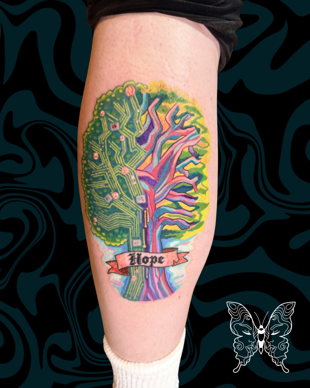 Hope tree new school tattoo on the calf by Nicci