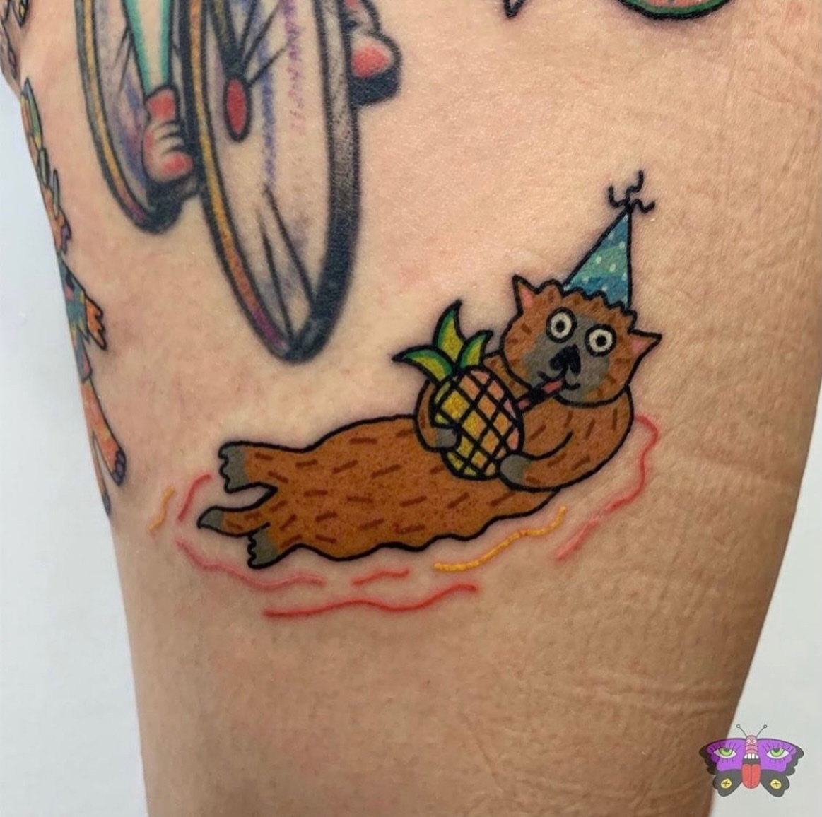 Cat with pineapple new school tattoo on the forearm by Jess Koala, San Francisco, California