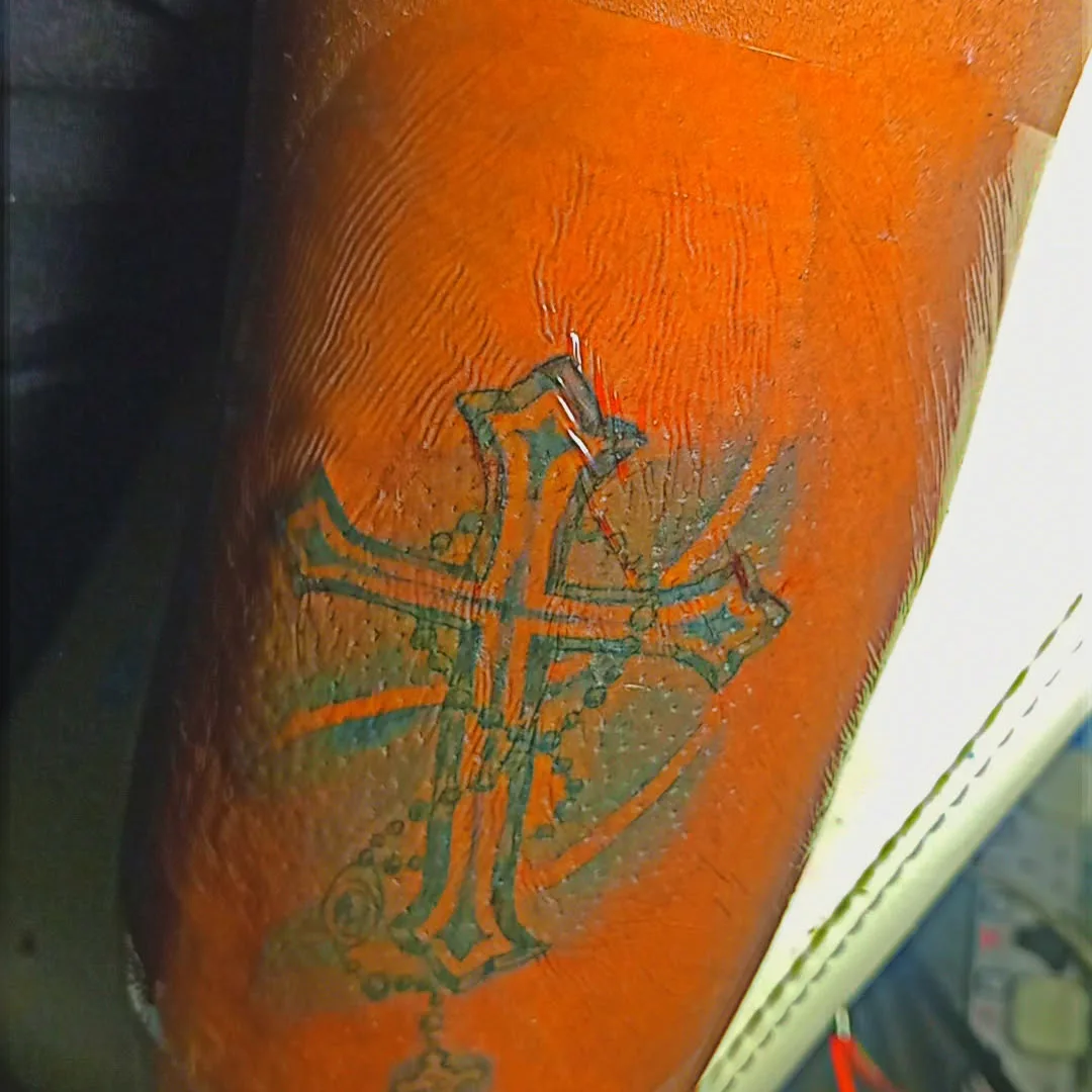 Cross American traditional tattoo on the forearm by Mwangaza Bodyworks, Uthiru, Nairobi Area, Kenya