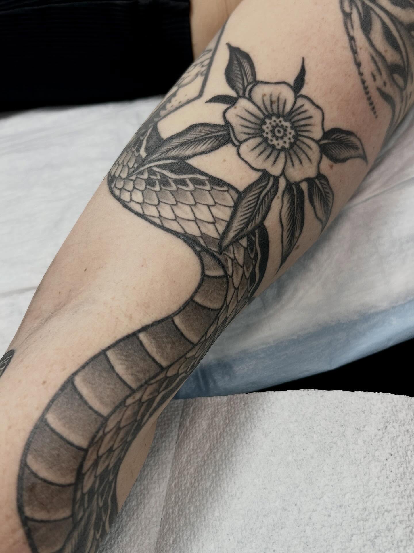 Snake and flower American traditional tattoo on the forearm by holly danesi . philadelphia tattoo, Philadelphia, Pennsylvania
