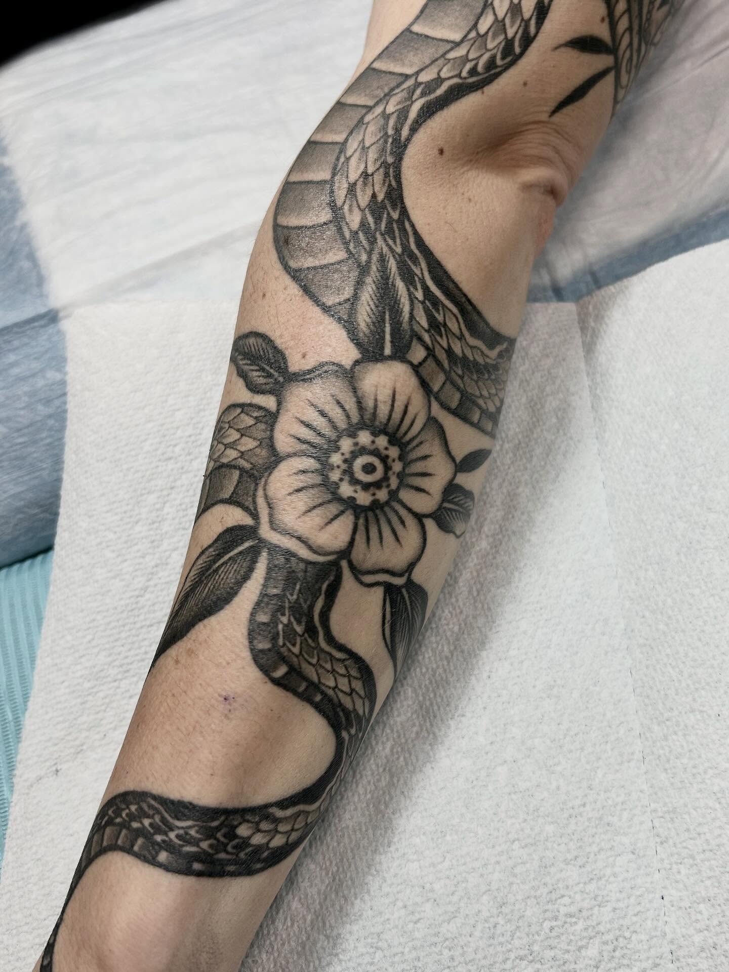 Snake and flower American traditional tattoo on the forearm by holly danesi . philadelphia tattoo, Philadelphia, Pennsylvania