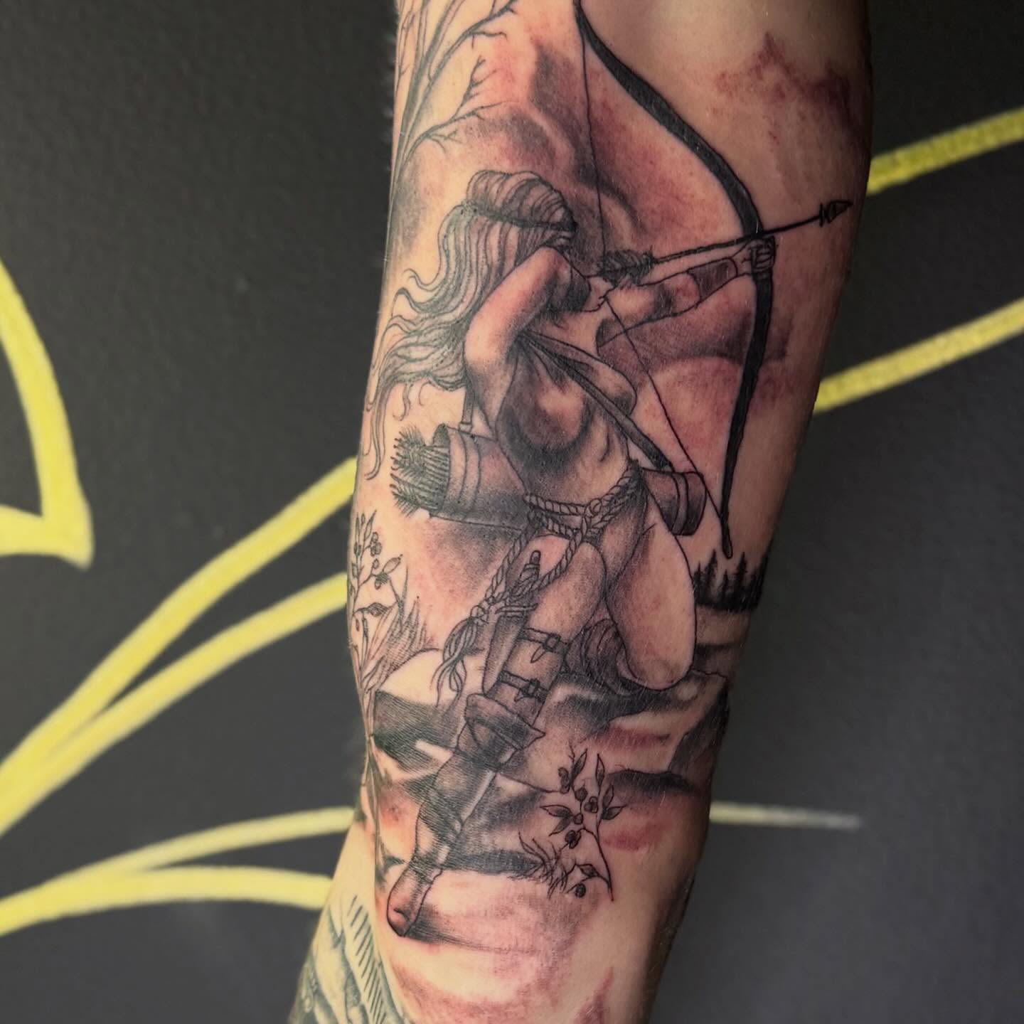 Archer realism tattoo on the forearm by Tattoos By Trish