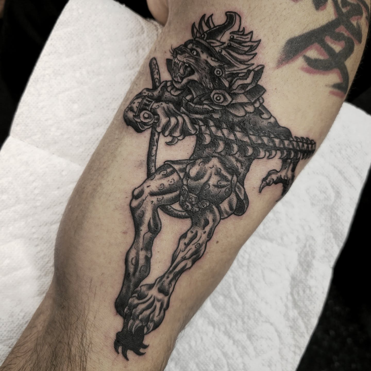 Demon warrior black and grey tattoo on the forearm by Tattoo Artist, Orange, California