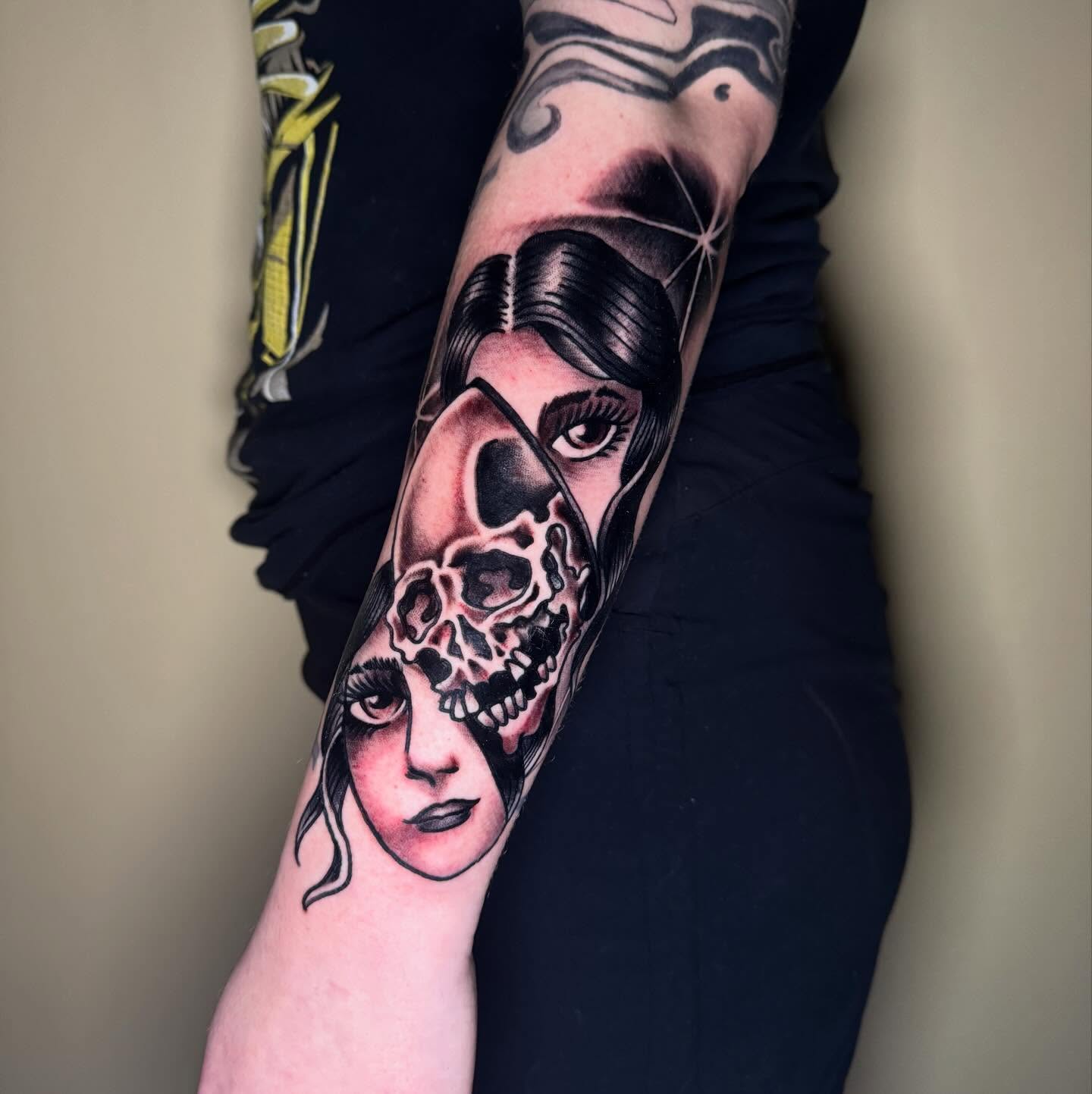 Woman with skull realism tattoo on the forearm by Mike Bean, Minneapolis, Minnesota