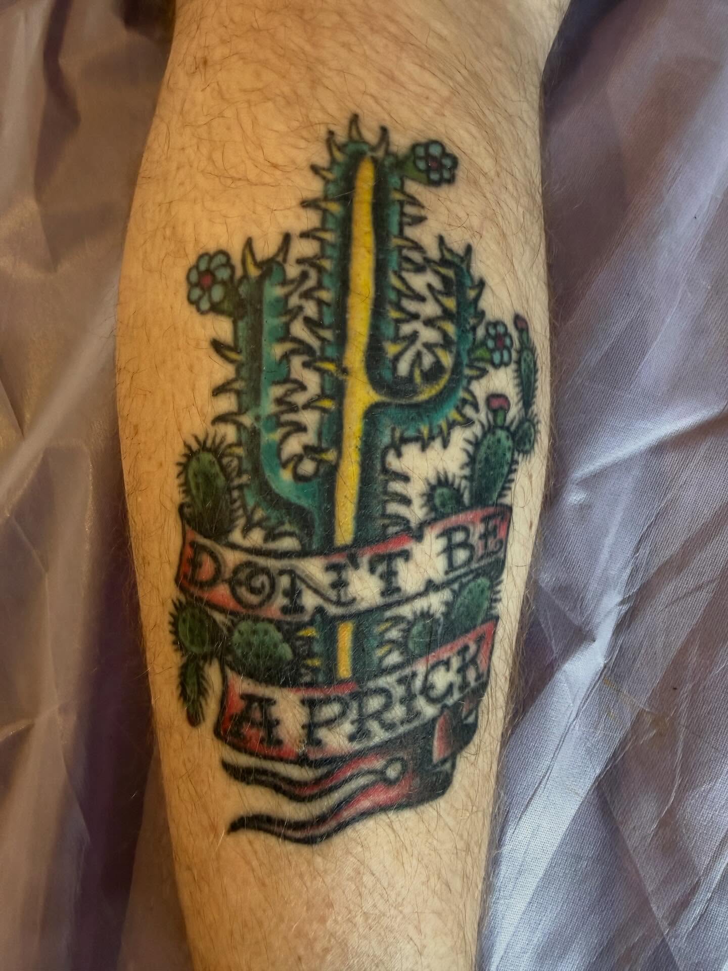 Cactus with text American traditional tattoo on the forearm by Mike Kepper