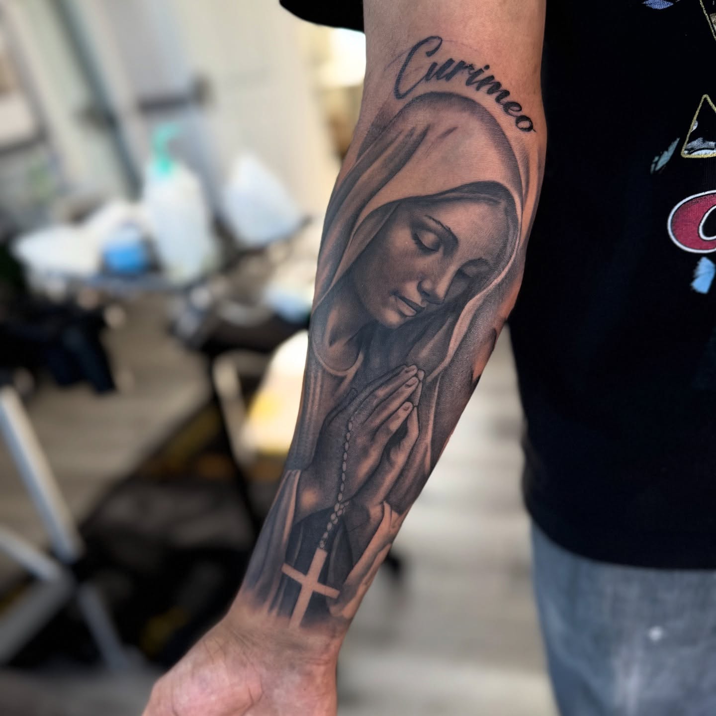 Praying woman realism tattoo on the forearm by Isiah Hall, Whittier, California