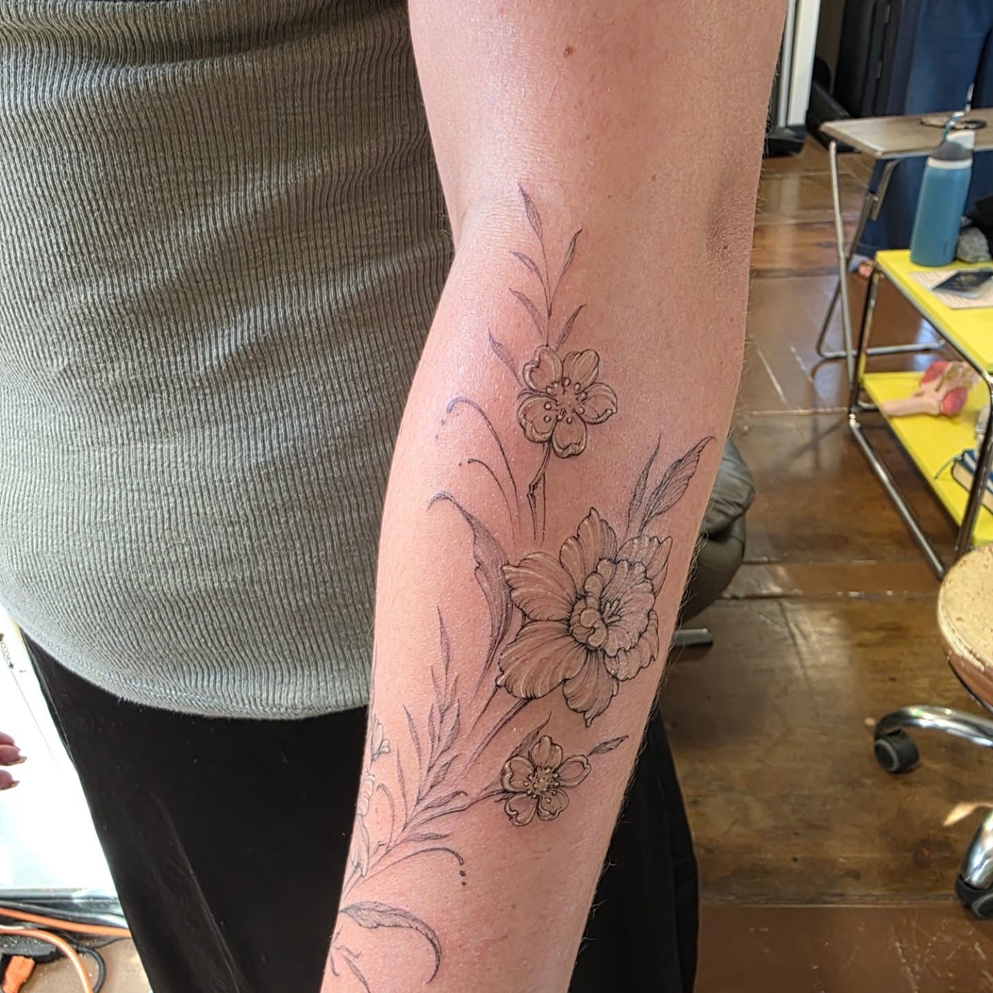 Floral arrangement black and grey tattoo on the forearm by Keith Countryman, Fort Worth, Texas