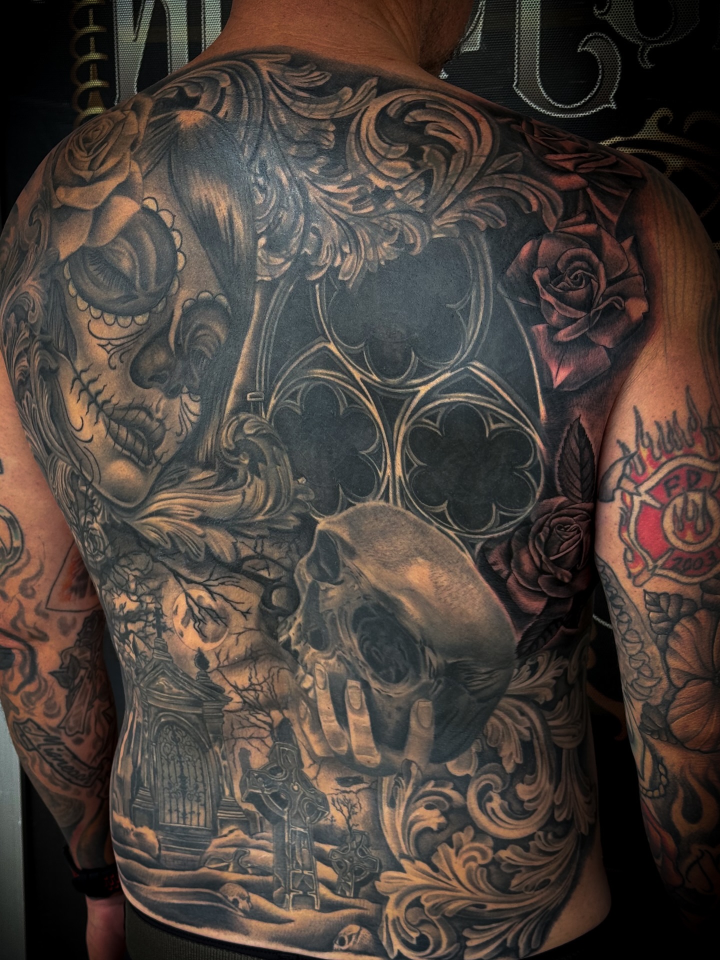Skulls and roses realism tattoo on the back by Lauren klose, Fort Myers, Florida