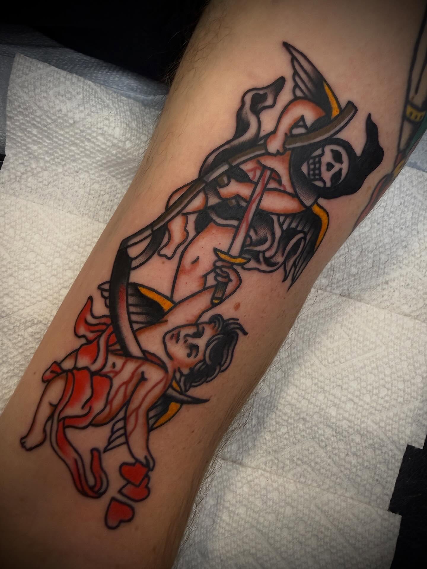 Cherub and skeleton American traditional tattoo on the forearm by Andrew Slater