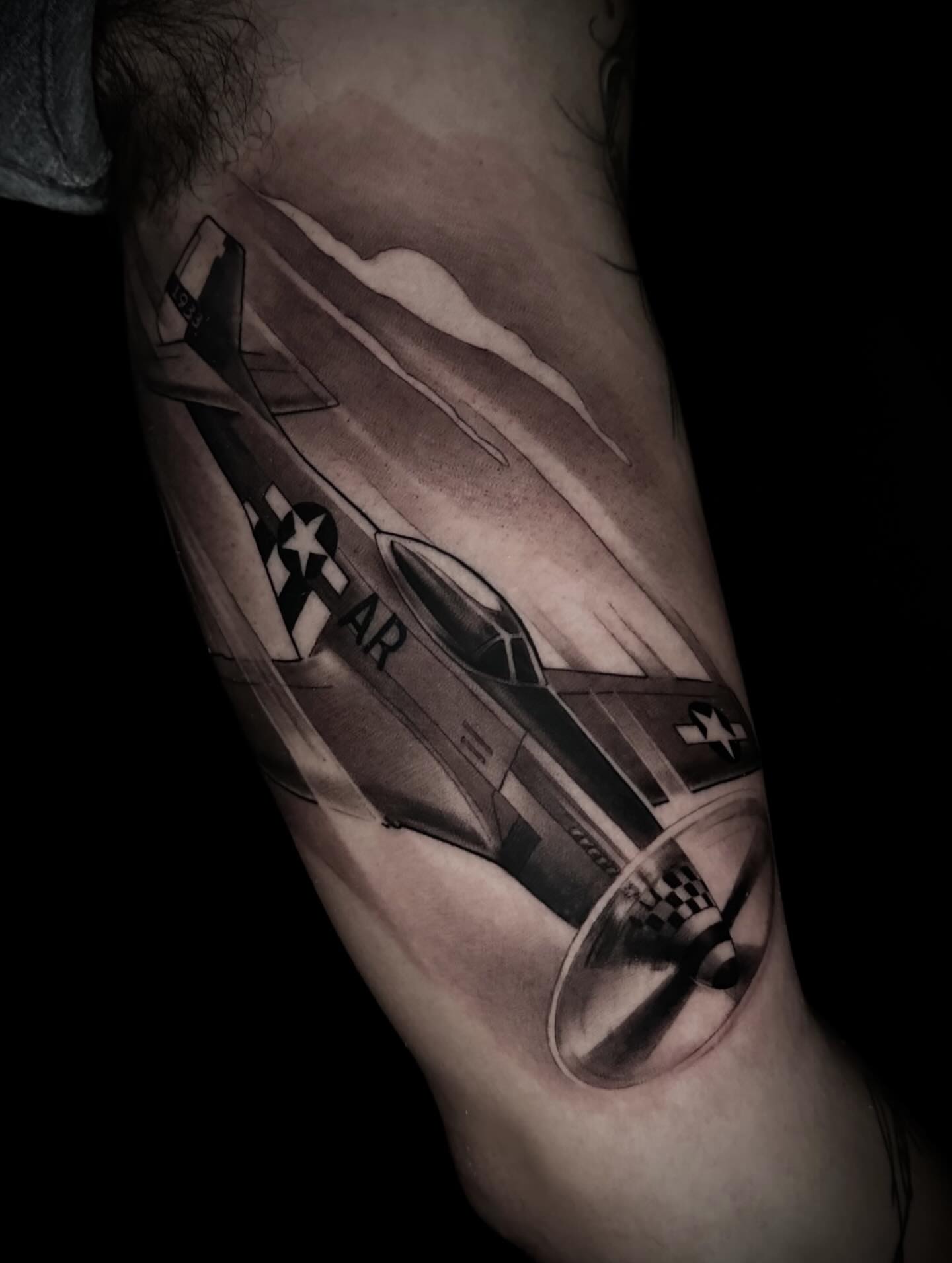 Fighter jet realism tattoo on the forearm by Nathan Adsit