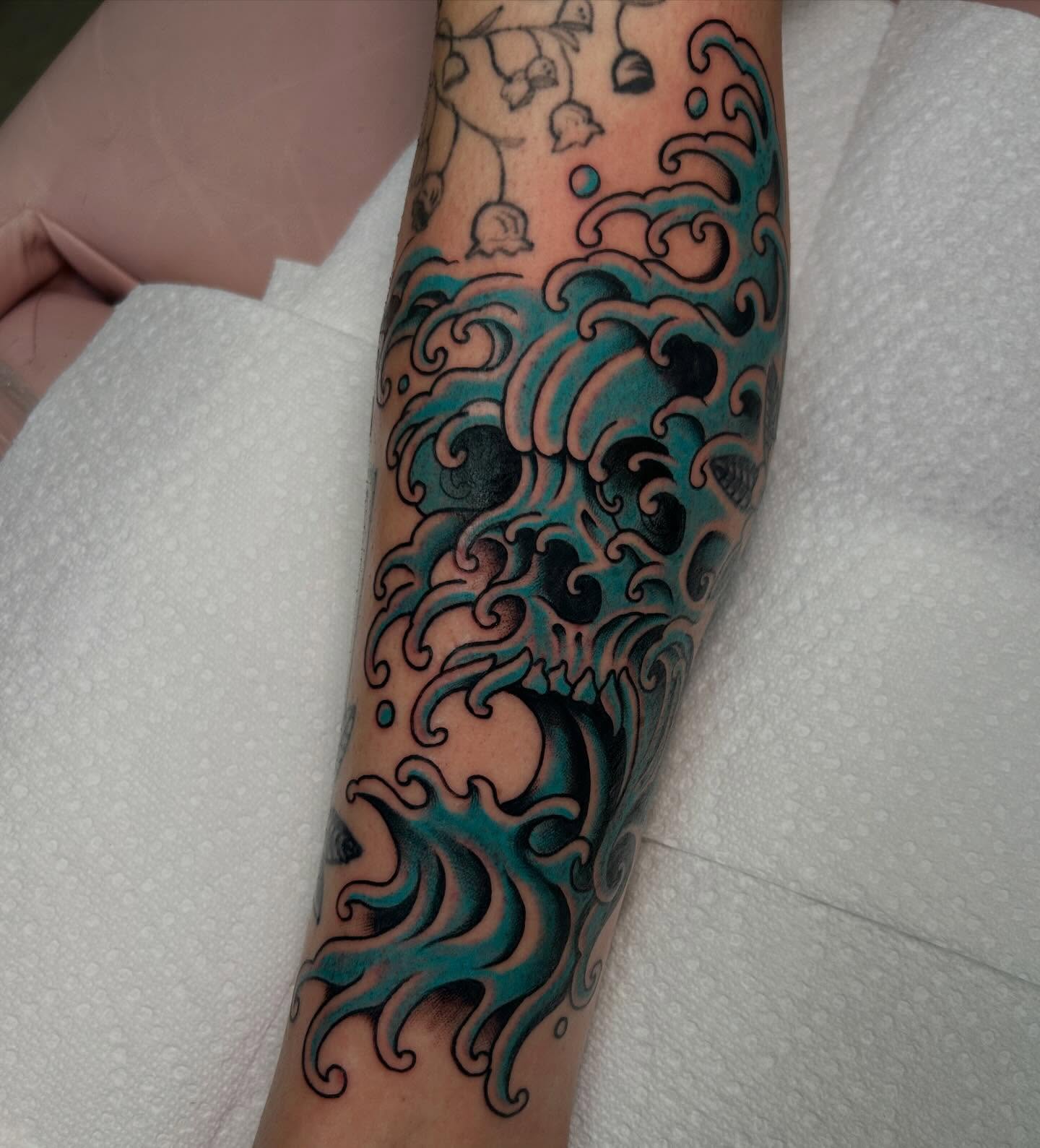 Waves japanese irezumi tattoo on the forearm by Katie Dexter, Des Moines, Iowa