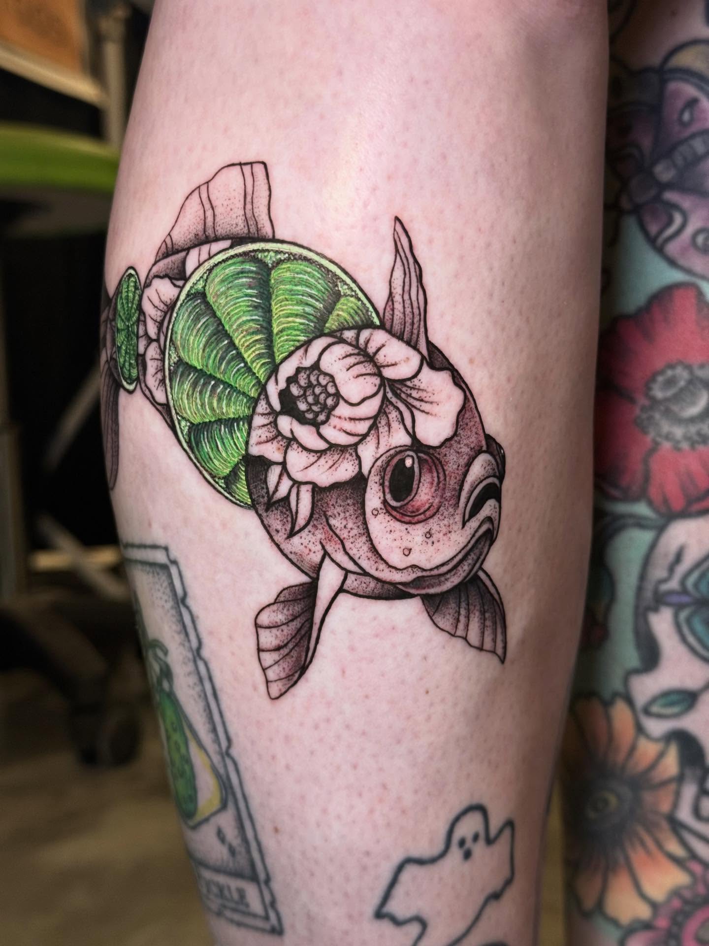 Fish with shell realism tattoo on the forearm by Max