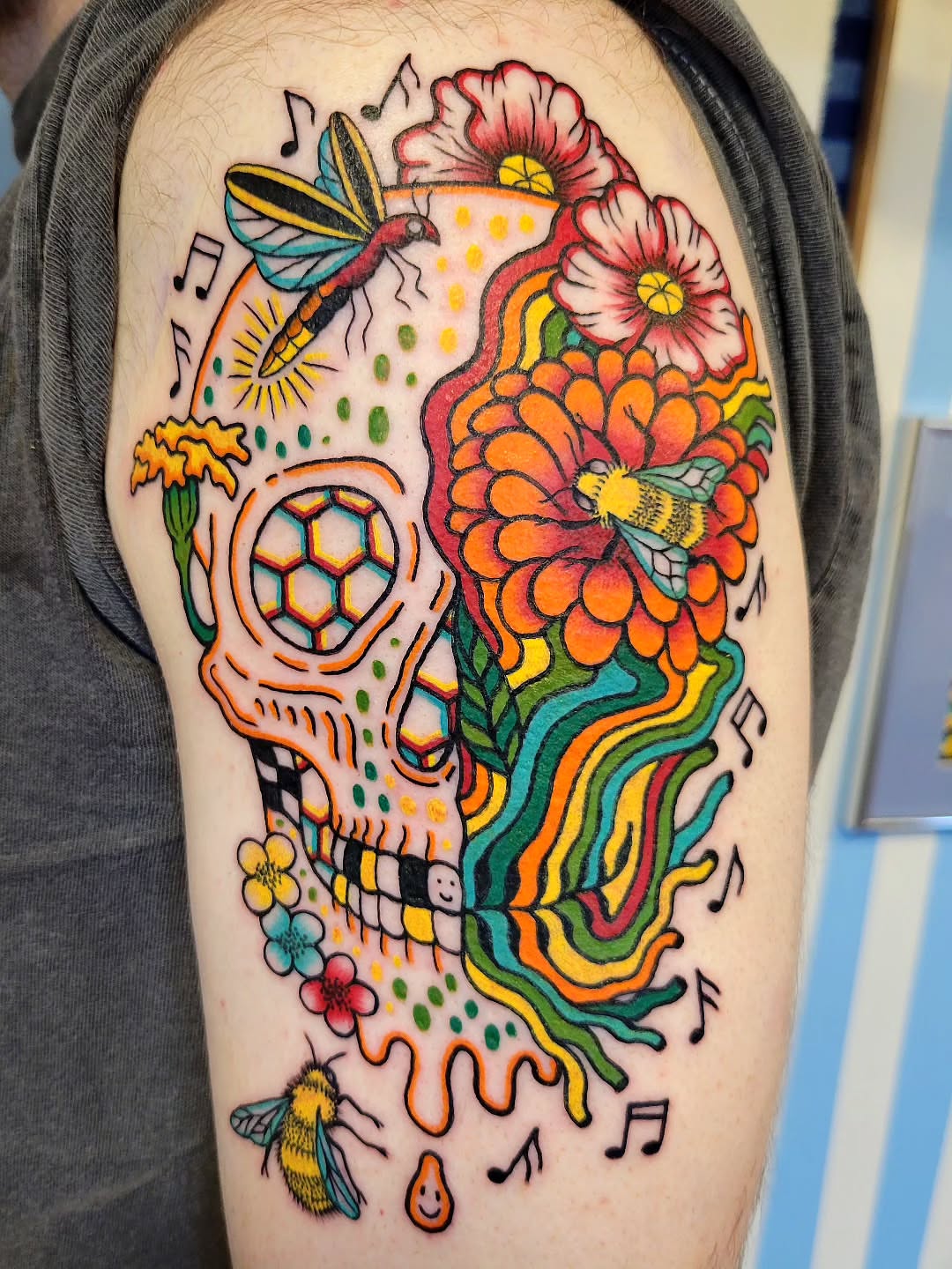 Sugar skull new school tattoo on the upper arm by Cat Wong意藝