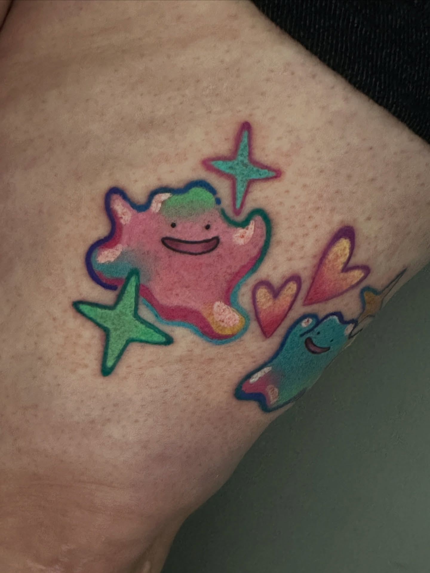 Starfish and hearts illustrative tattoo on the forearm by Dustin Hughes