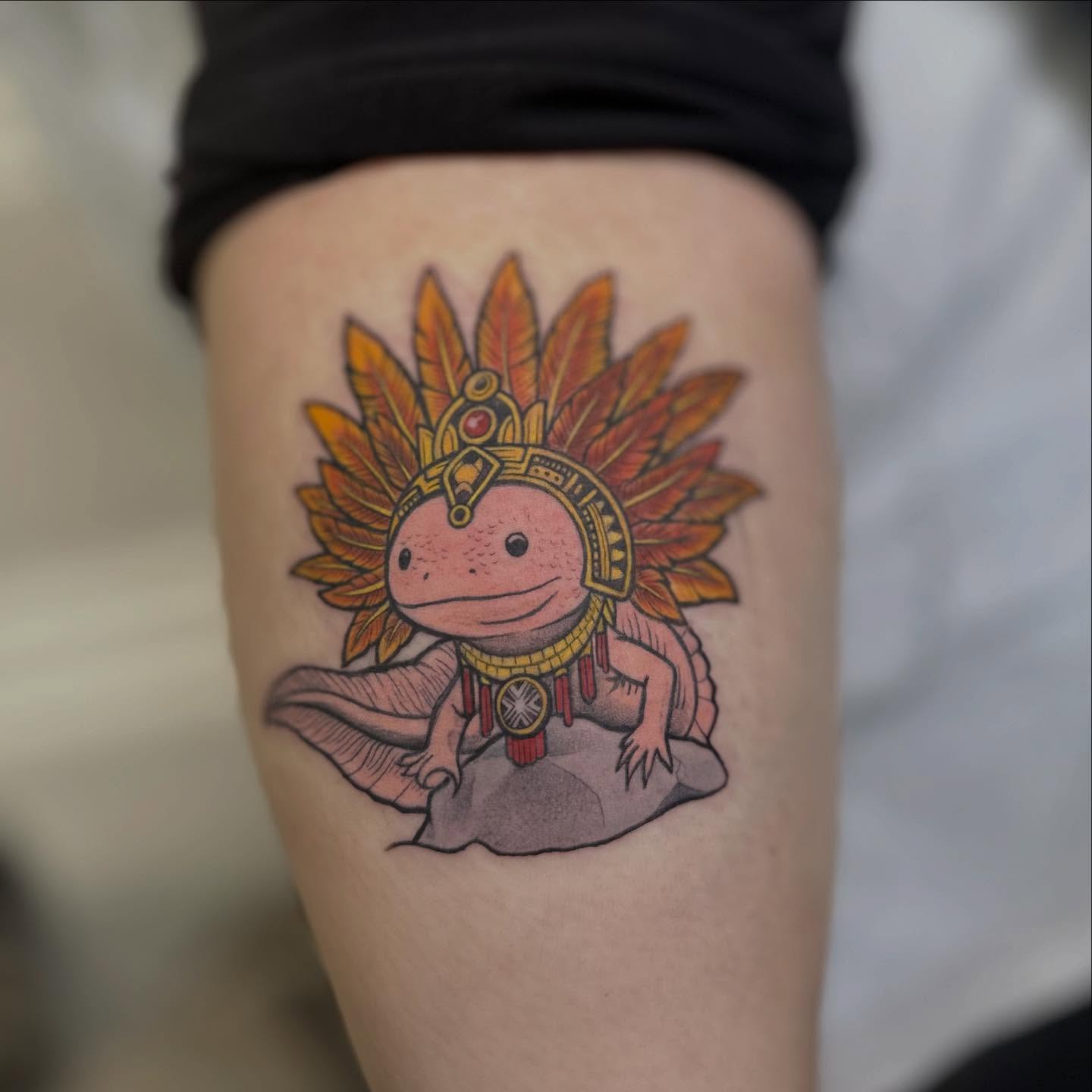 Axolotl with headdress illustrative tattoo on the thigh by Vicious Marc