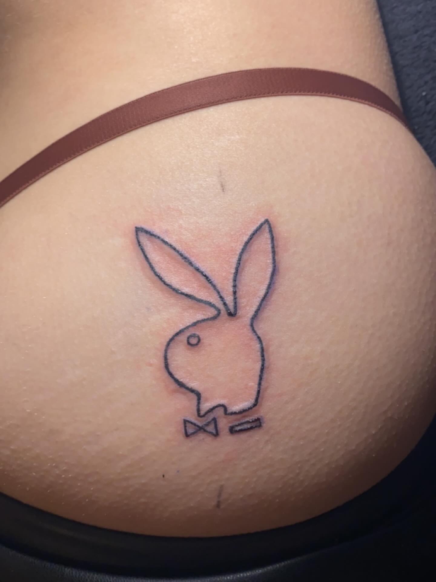 Playboy bunny black and grey tattoo on the thigh by 𝒯𝒶𝓉𝓈𝑜𝓊𝓁 𝒷𝓎 C𝓁𝒶𝓊𝒹𝒾𝒶