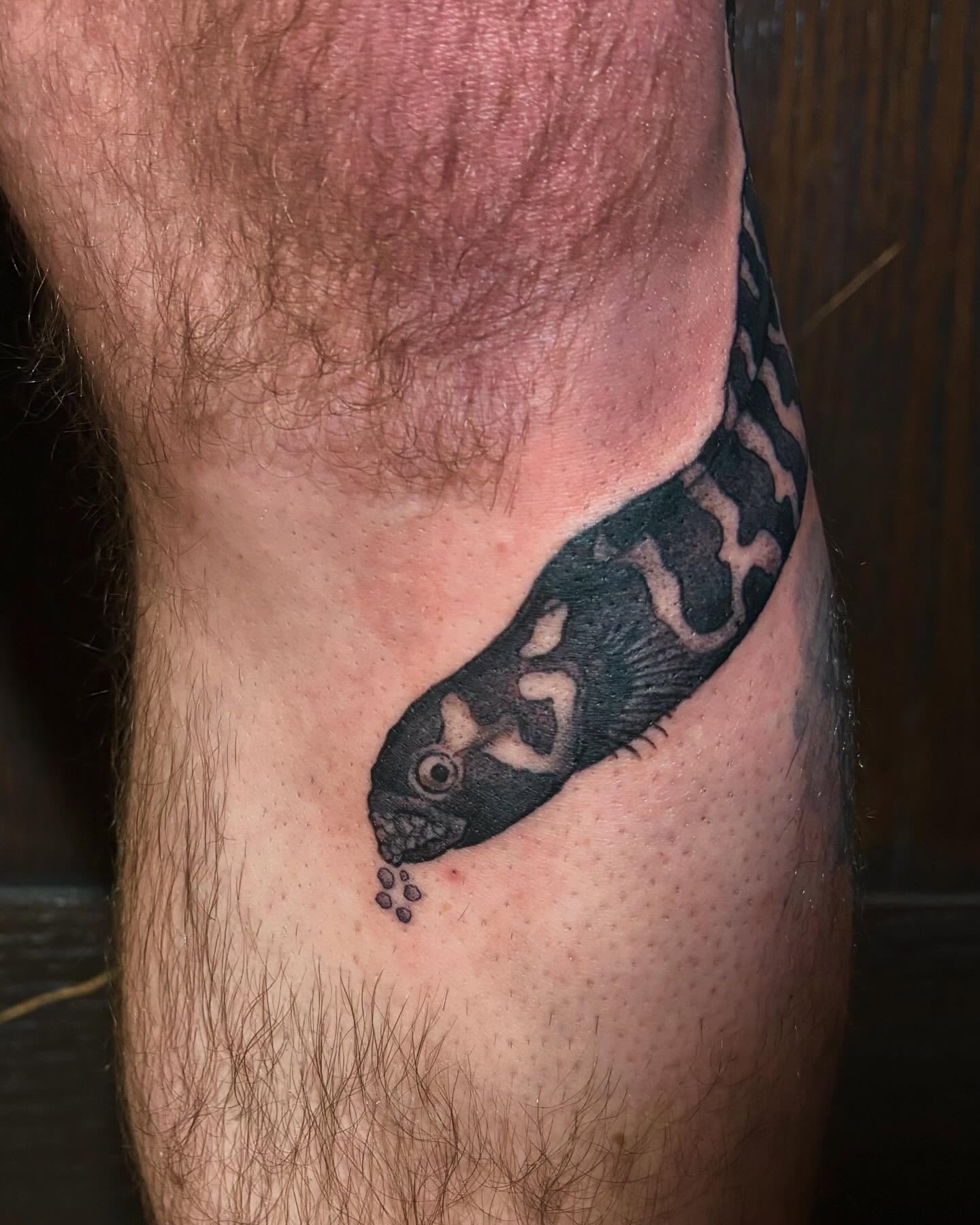 Fish realism tattoo on the thigh by kane