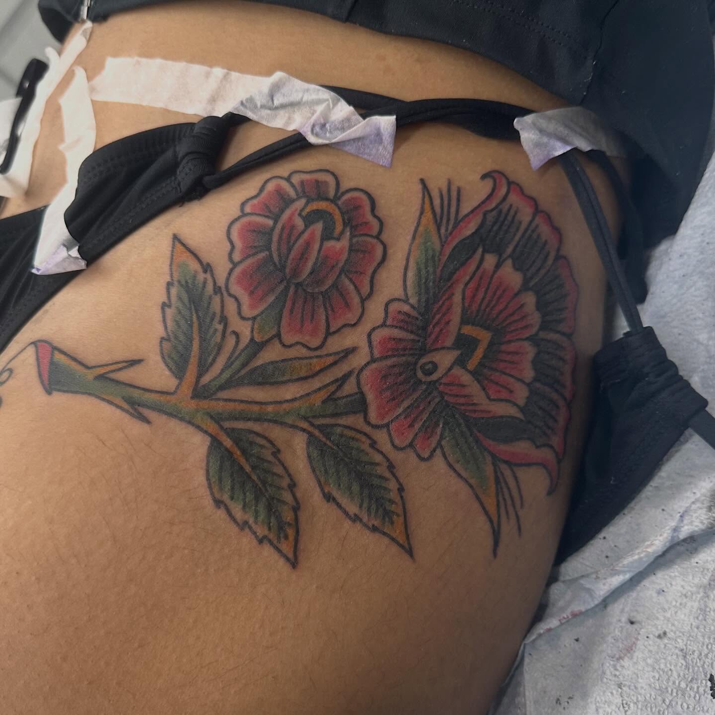 Floral arrangement American traditional tattoo on the thigh by Fil Ponte