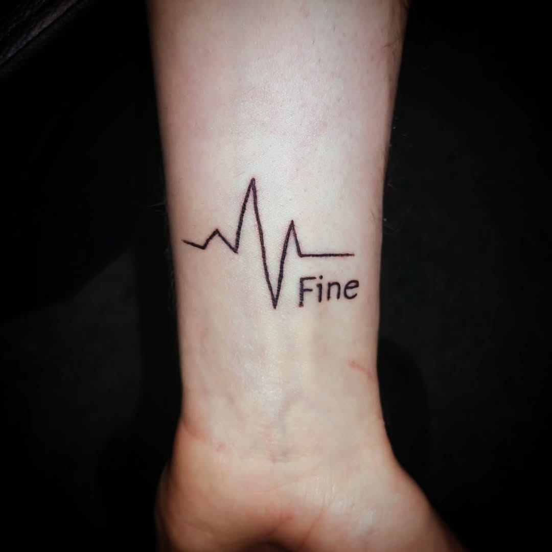 Heartbeat line with text tattoo by Anntonietta Borzacchiello
