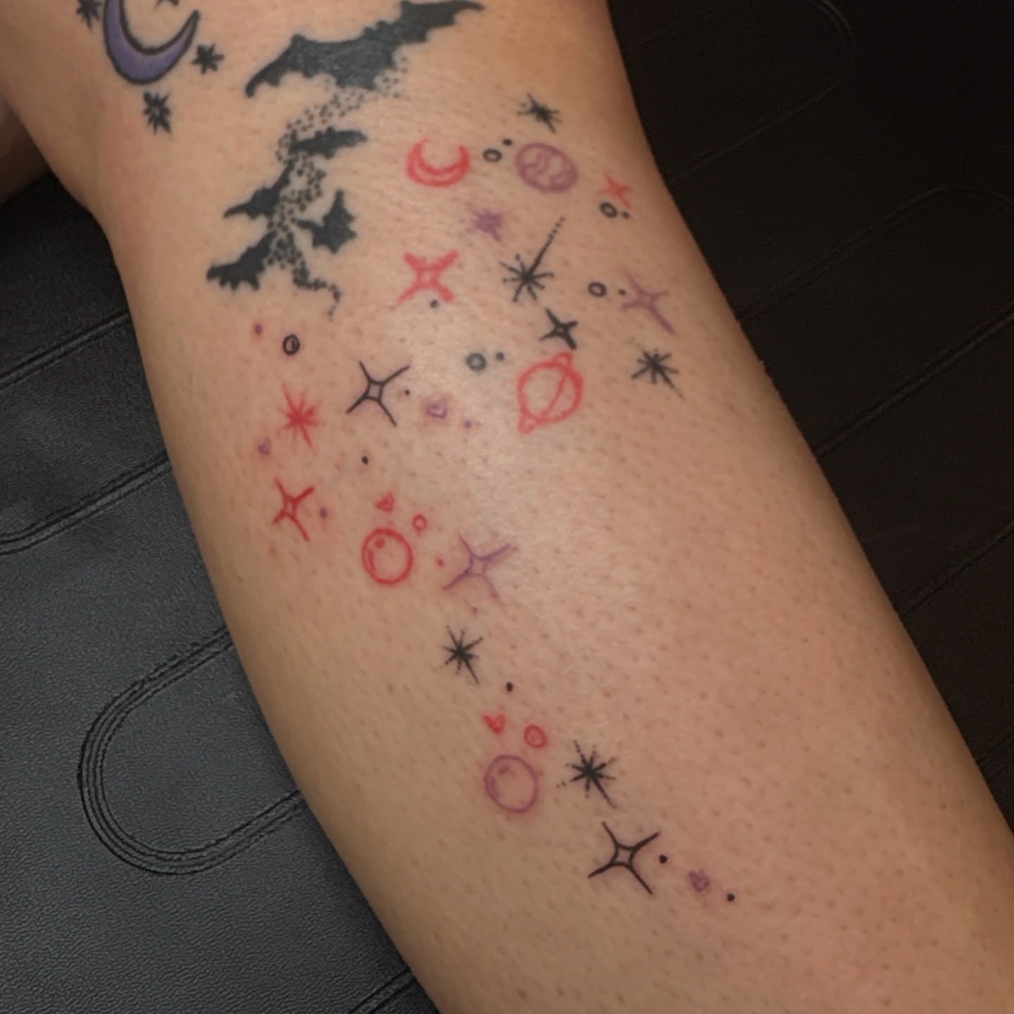 Space-themed symbols dotwork tattoo on the forearm by Emma🌸✨Austin Tattoo Artist