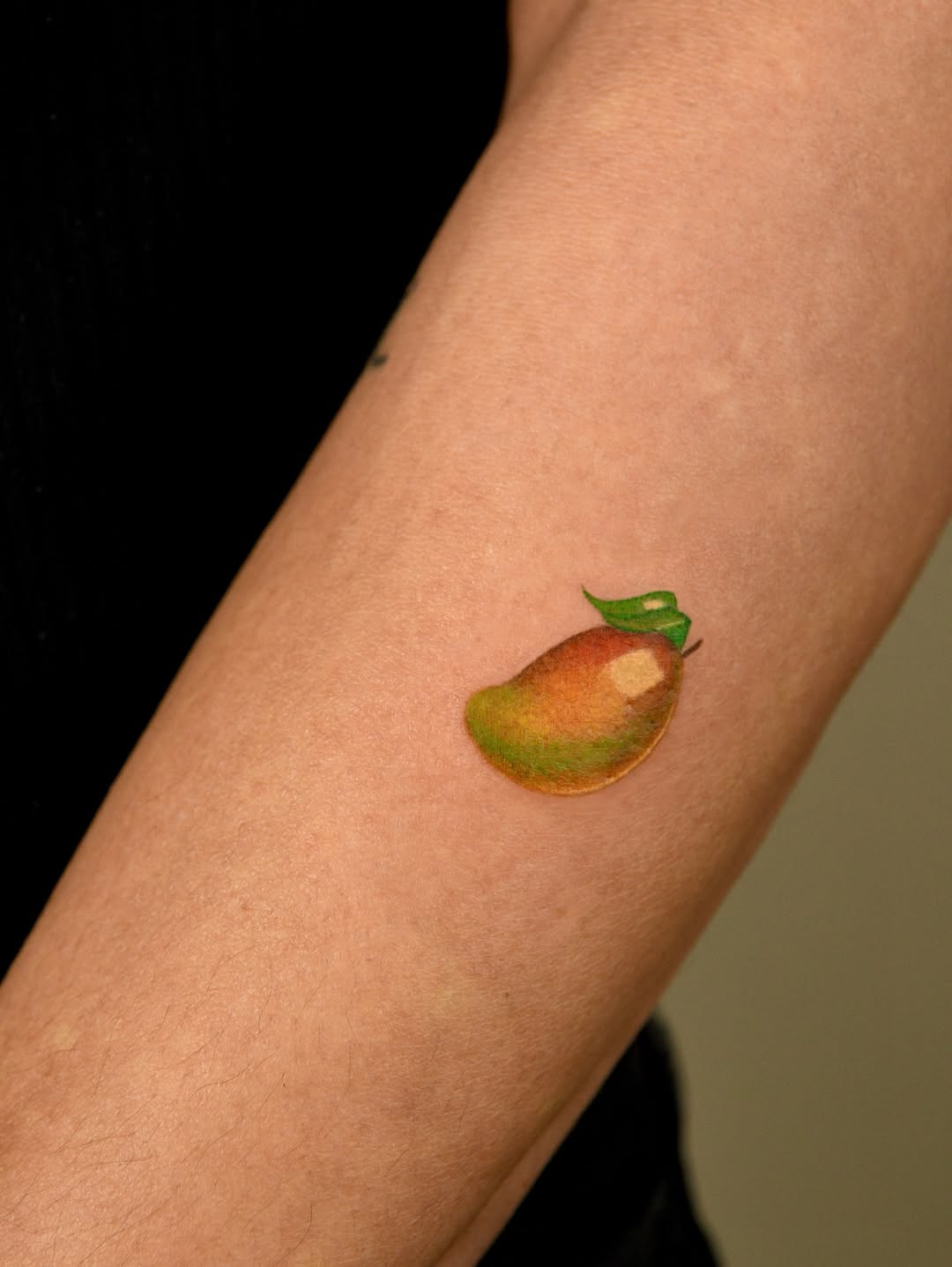 Mango watercolor tattoo on the forearm by ๐ก๐ฎ๐ป๐ฐ๐ โง ๐ก๐ฌ๐ ๐ง๐๐ง๐ง๐ข๐ข ๐๐ฅ๐ง๐๐ฆ๐งโง