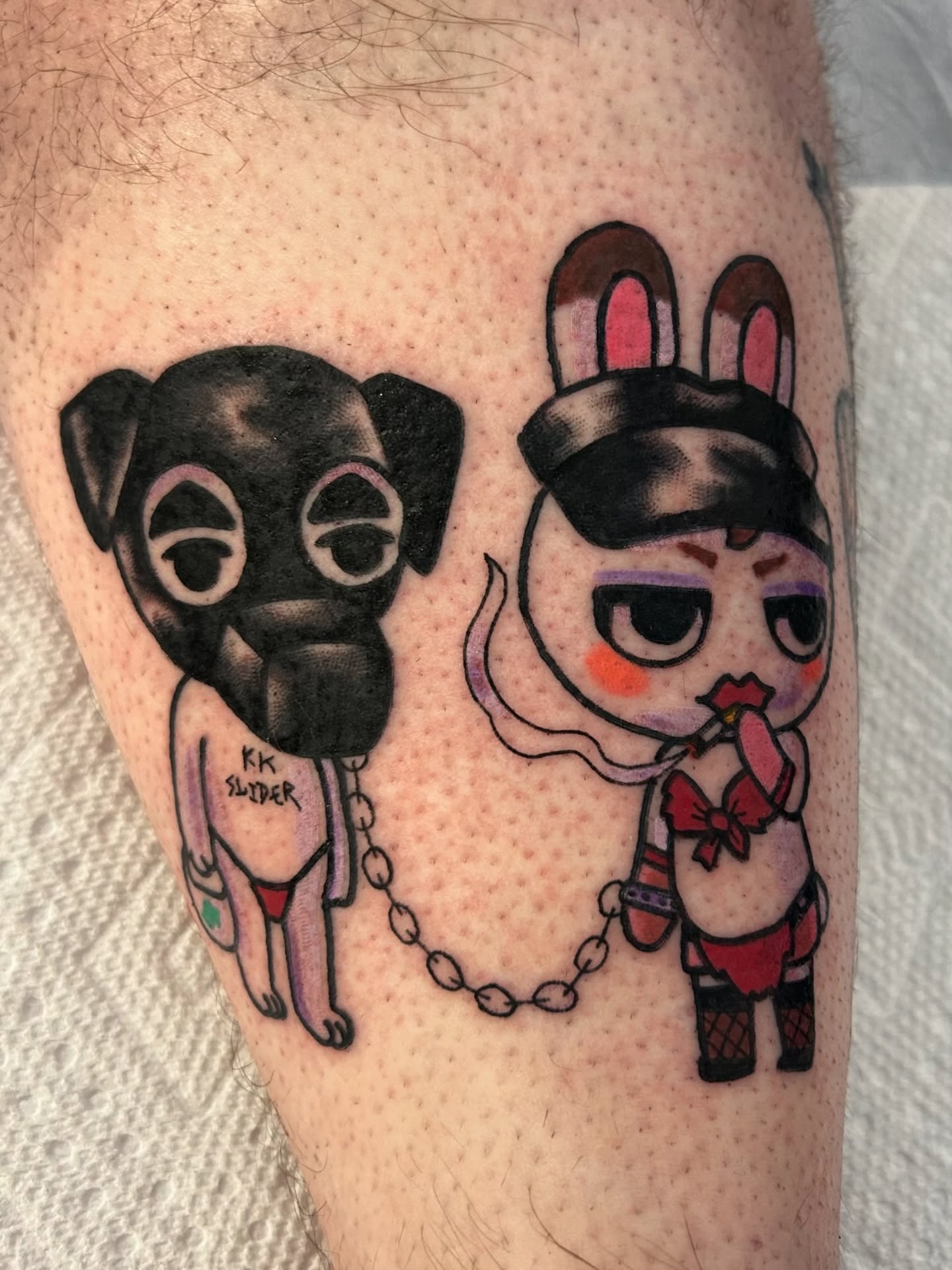 Dog and rabbit anime tattoo on the thigh by Ollie