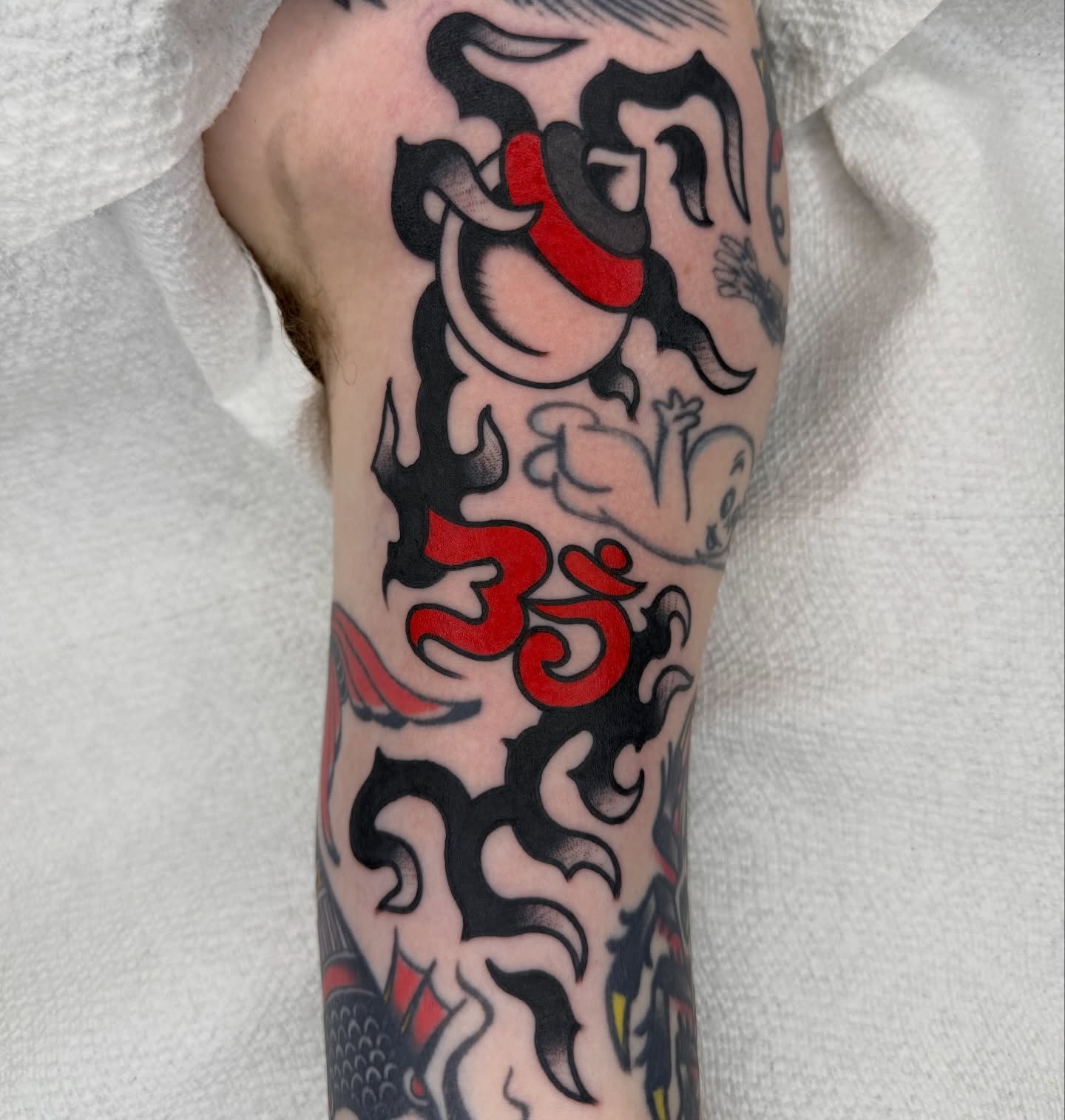 Om symbol American traditional tattoo on the forearm by لا Kenny McCabe لا