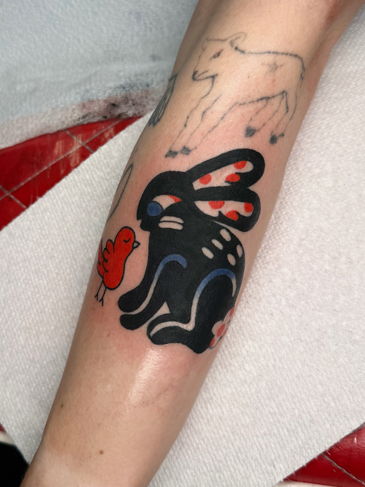 Rabbit and bird dotwork tattoo on the forearm by lily gustave i tattoo