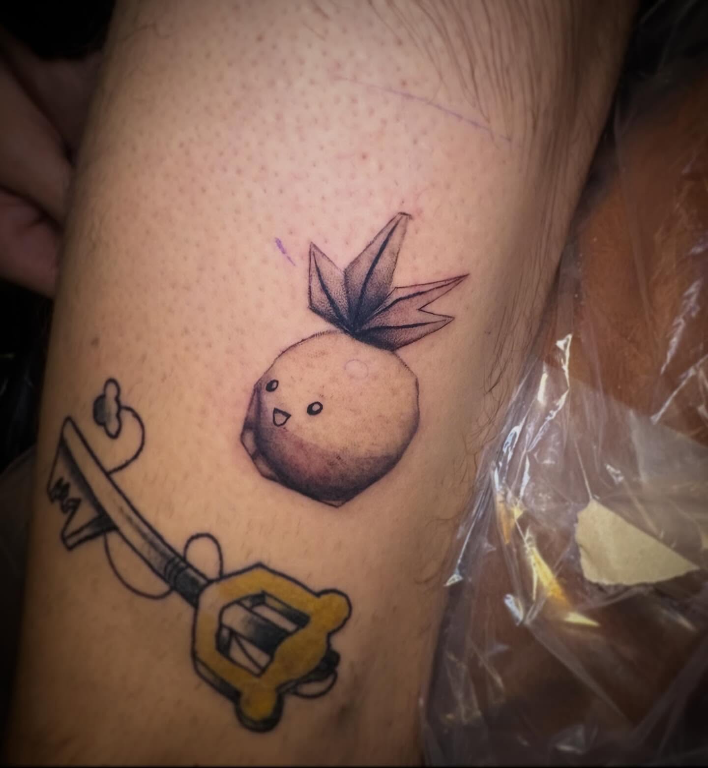 Chicken and key new school tattoo on the forearm by Haley Byers