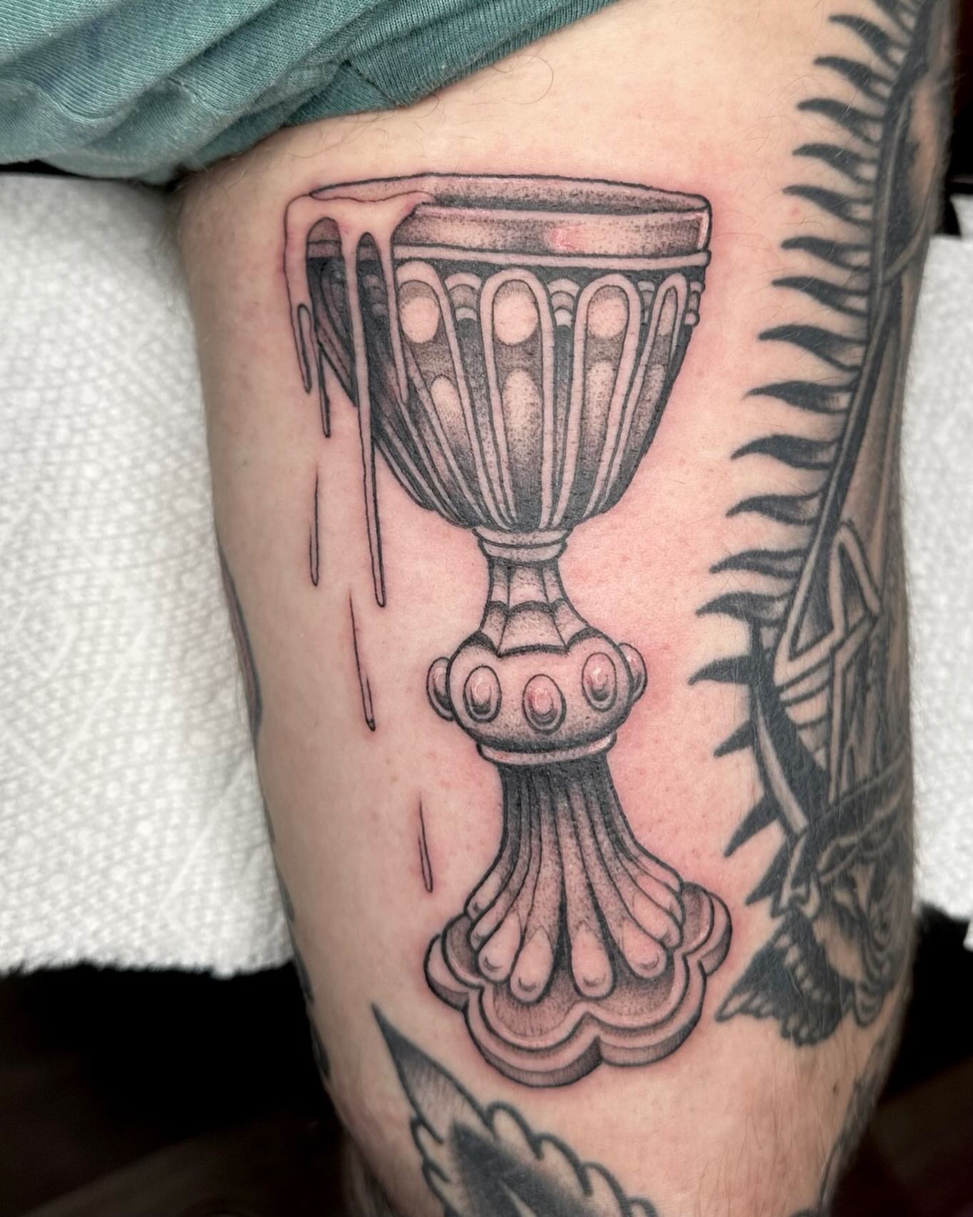 Chalice black and grey tattoo on the forearm by Lia Massari
