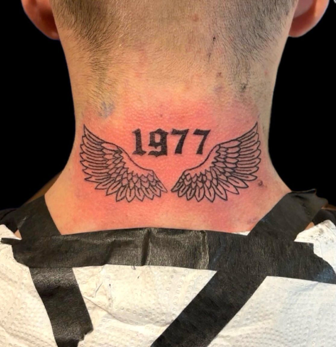 1977 wings black and grey tattoo on the neck by 𝒯𝒶𝓉𝓈𝑜𝓊𝓁 𝒷𝓎 C𝓁𝒶𝓊𝒹𝒾𝒶