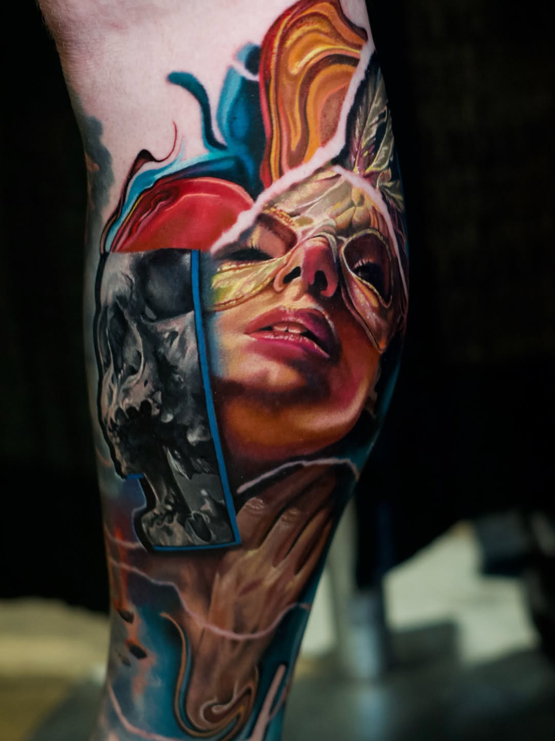 Skull and woman with mask surrealism tattoo on the forearm by Justin Shelpman