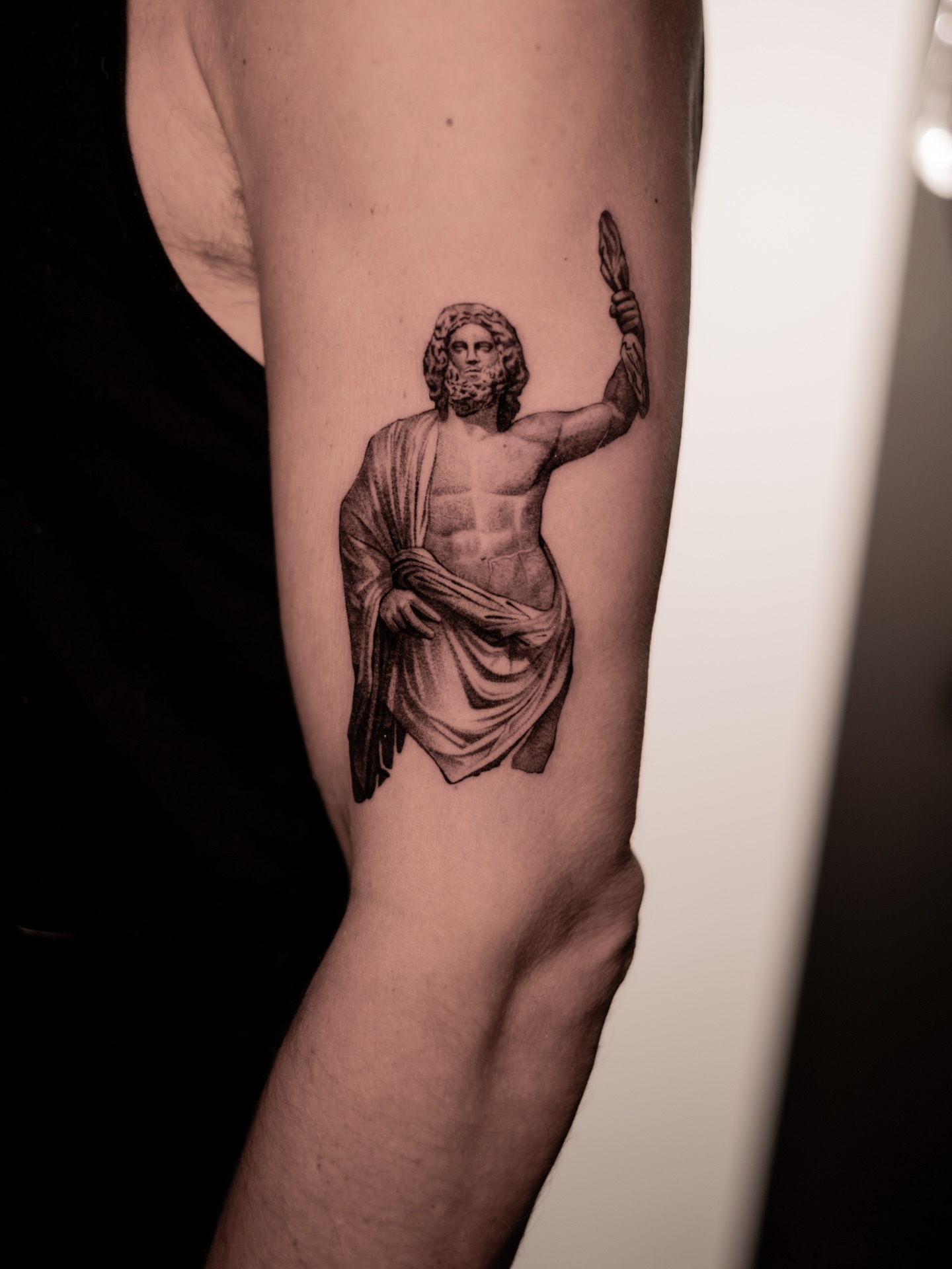 Statue of zeus black and grey tattoo on the forearm by Mark D, Los Angeles, California