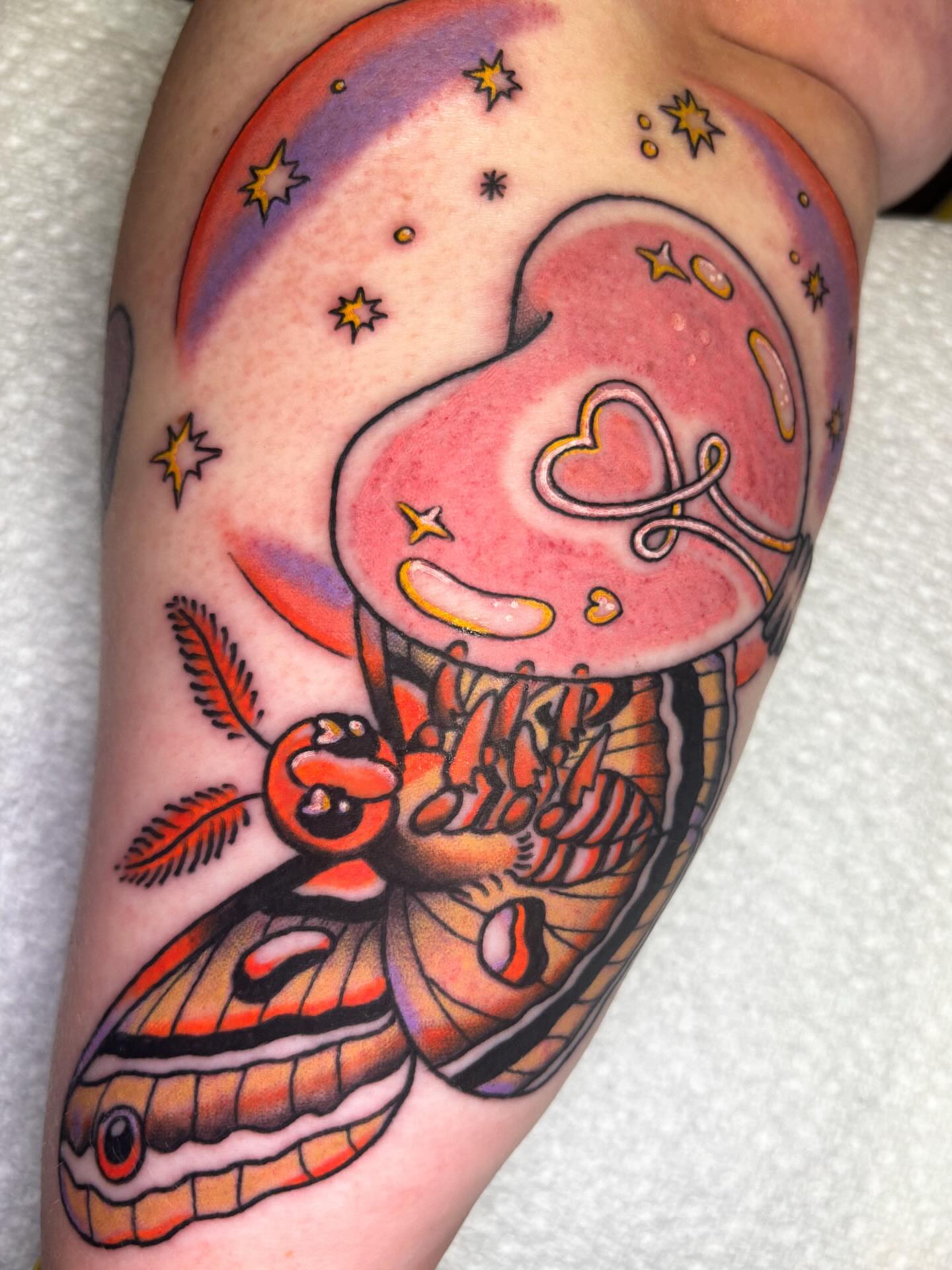 Butterfly and mushroom American traditional tattoo on the forearm by Katelyn Spence