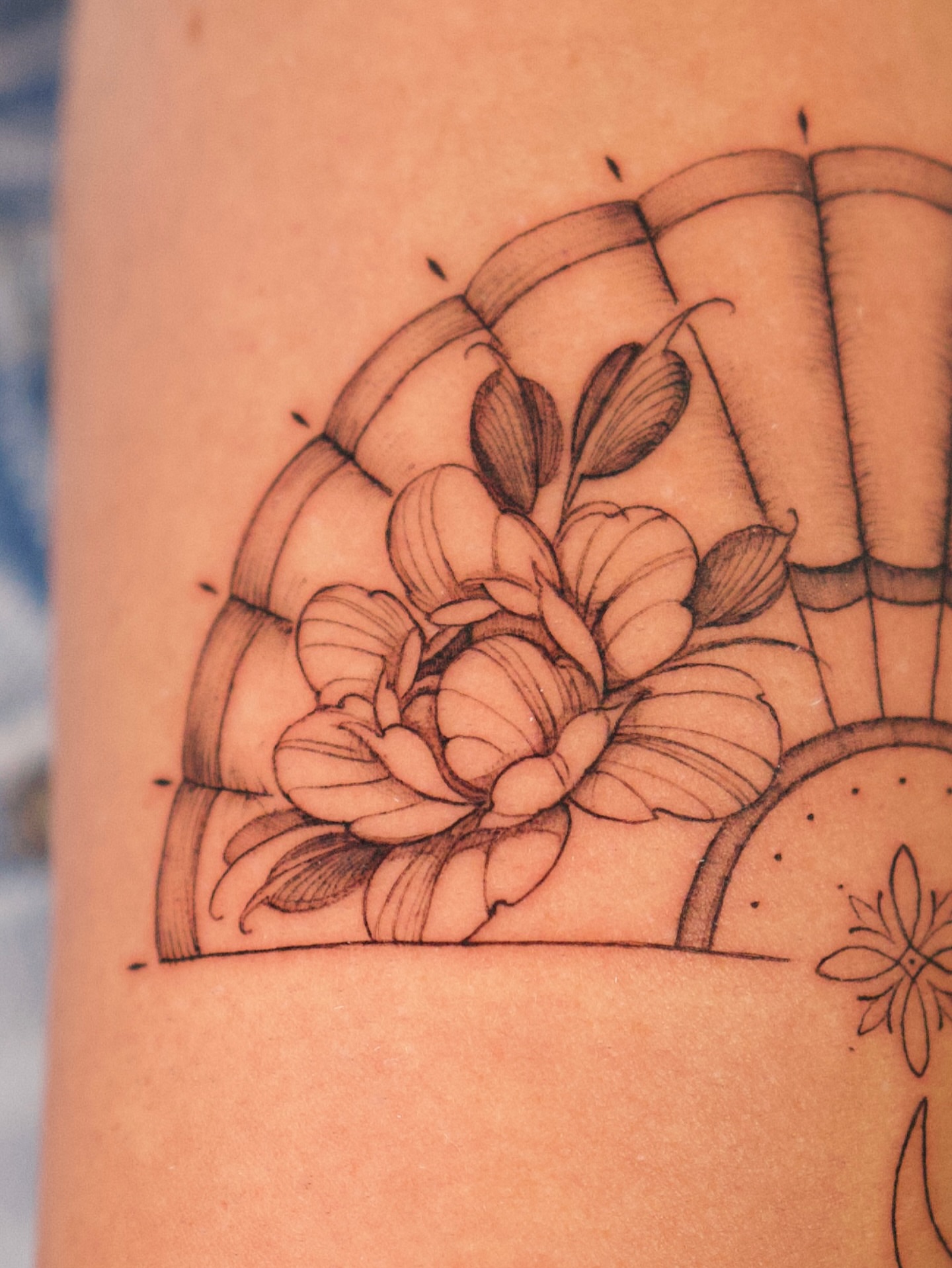 Flower black and grey tattoo on the forearm by Tattoo fine line NY