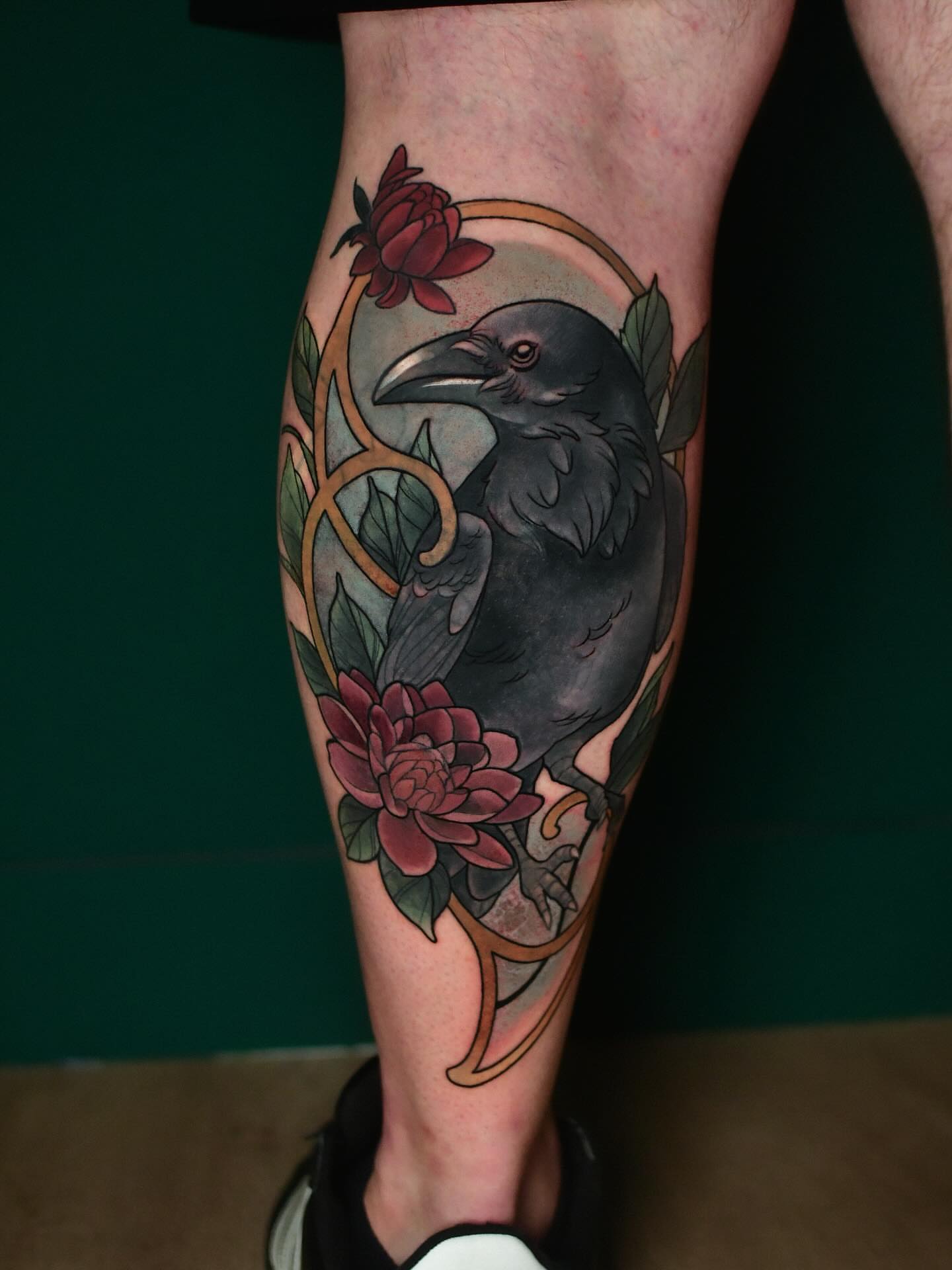 Crow and flowers realism tattoo on the calf by Karina πΌ Orange County Tattoo Artist