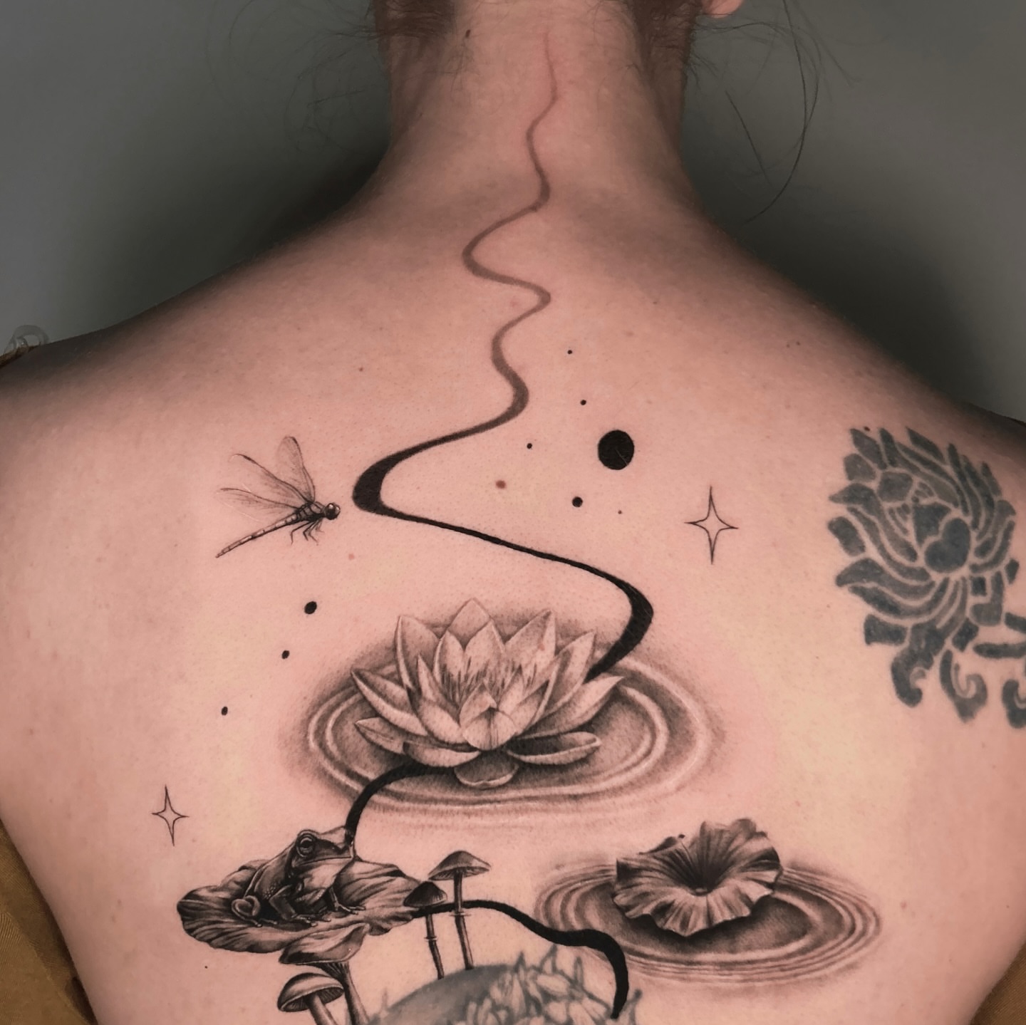 Lotus flower and dragonfly realism tattoo on the back by Longtea