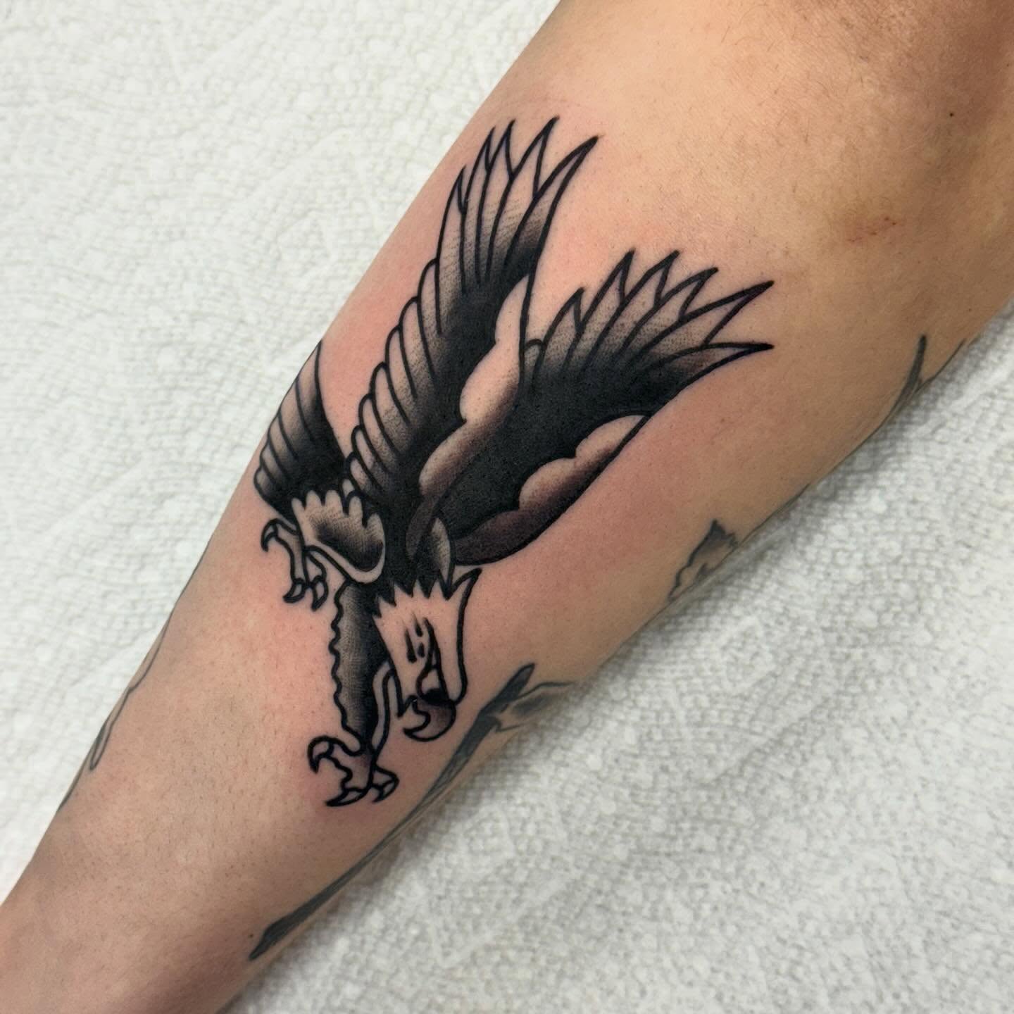 Eagle black and grey tattoo on the forearm by Ben