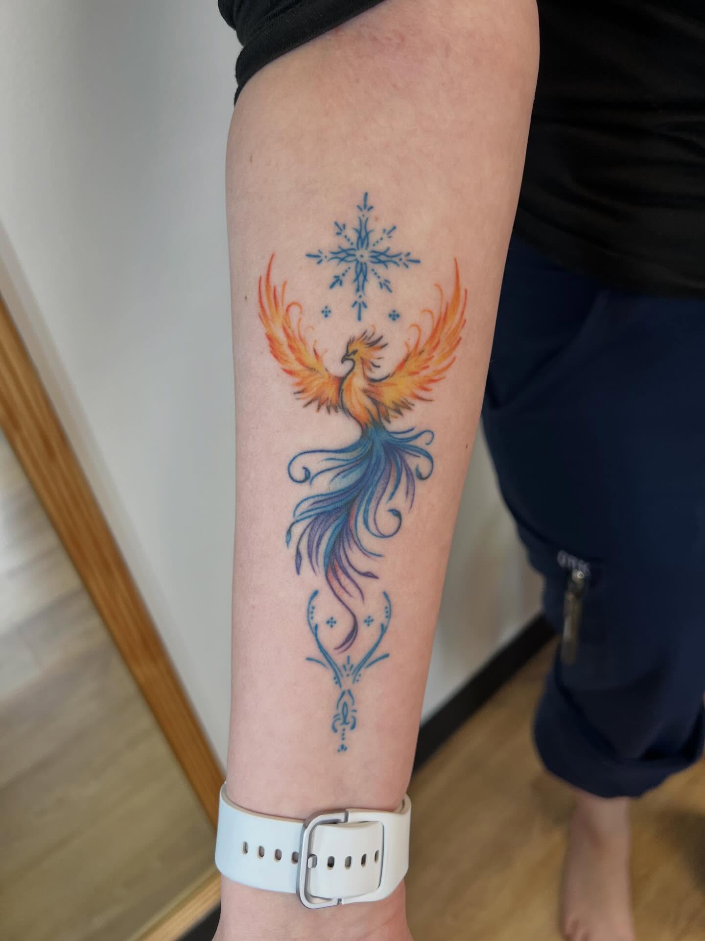 Phoenix new school tattoo on the forearm by Presley Tattoos, Murfreesboro, Tennessee