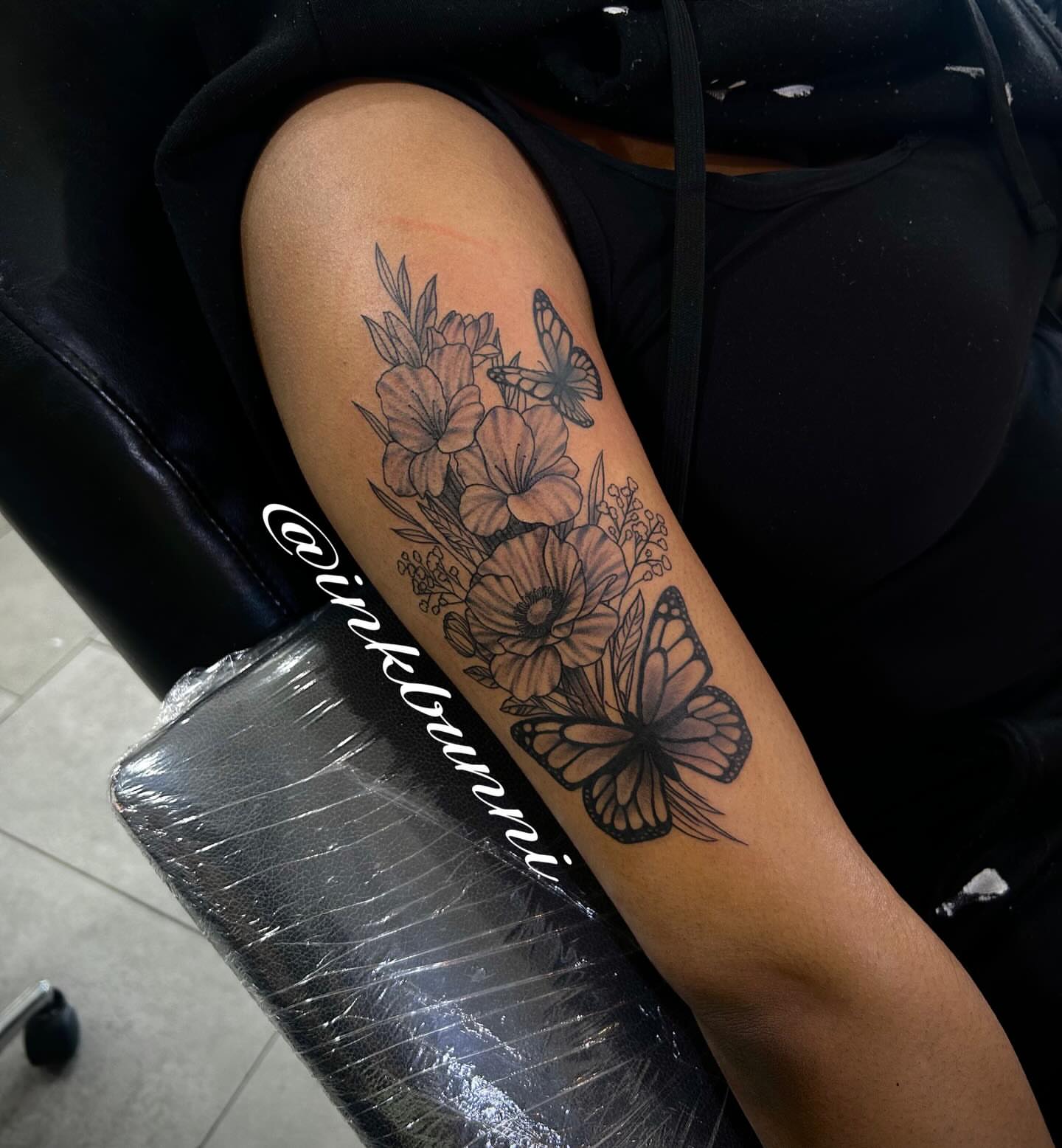 Flowers and butterflies black and grey tattoo on the forearm by Hailey Aka inkbunni, Detroit, Michigan