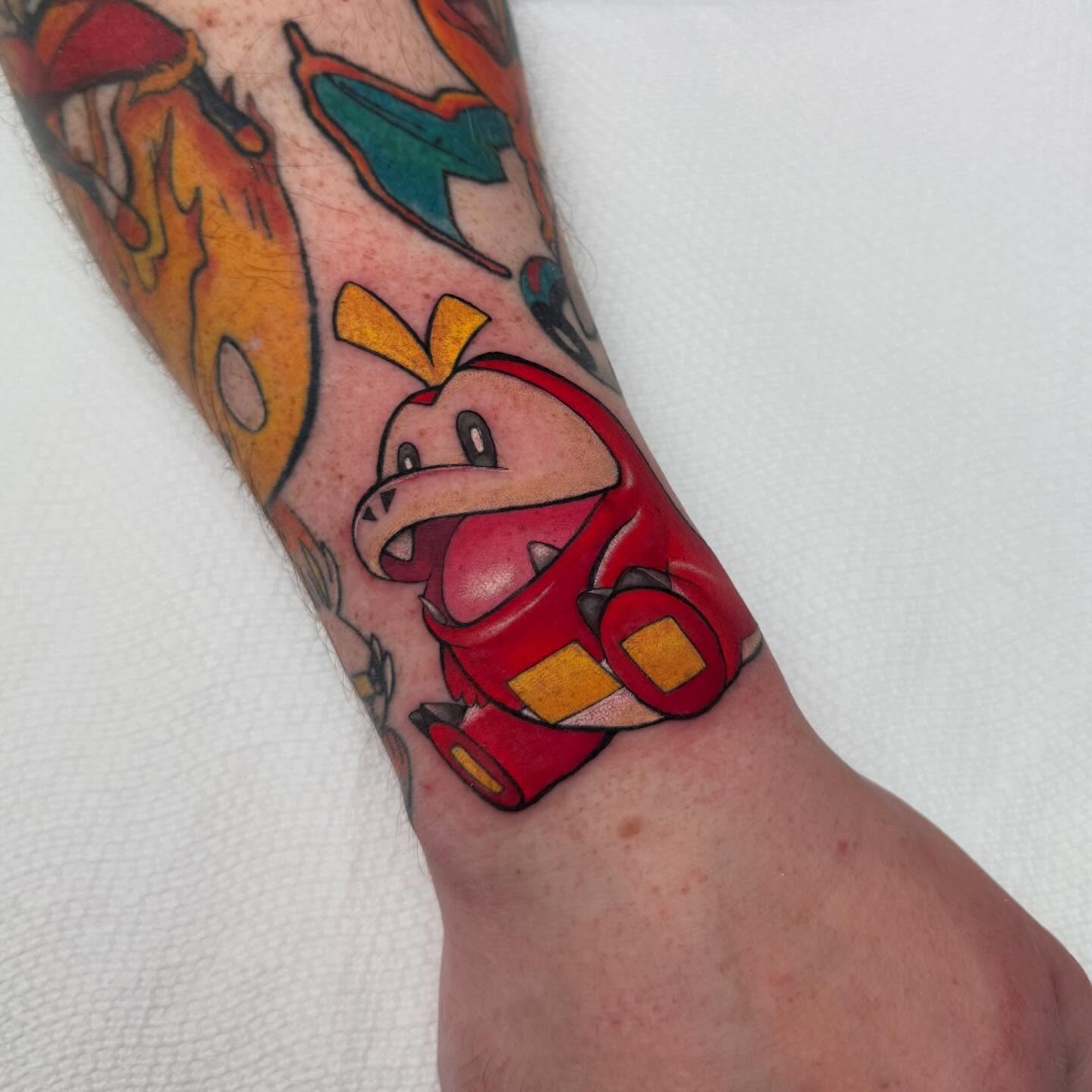 Angry bird new school tattoo on the forearm by Alexia
