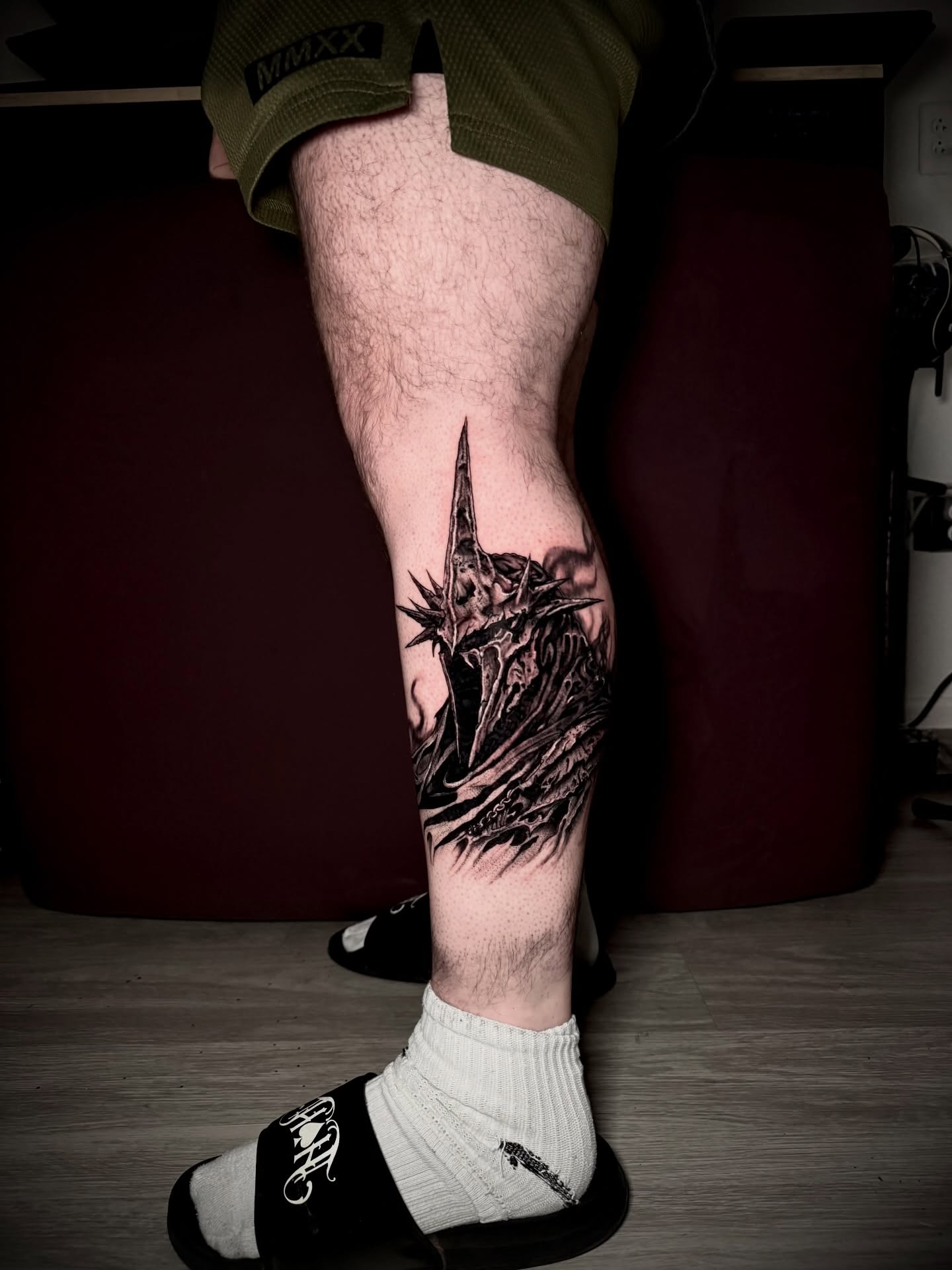 Orc helmet dark realism tattoo on the calf by 𖤐Dillon𖤐