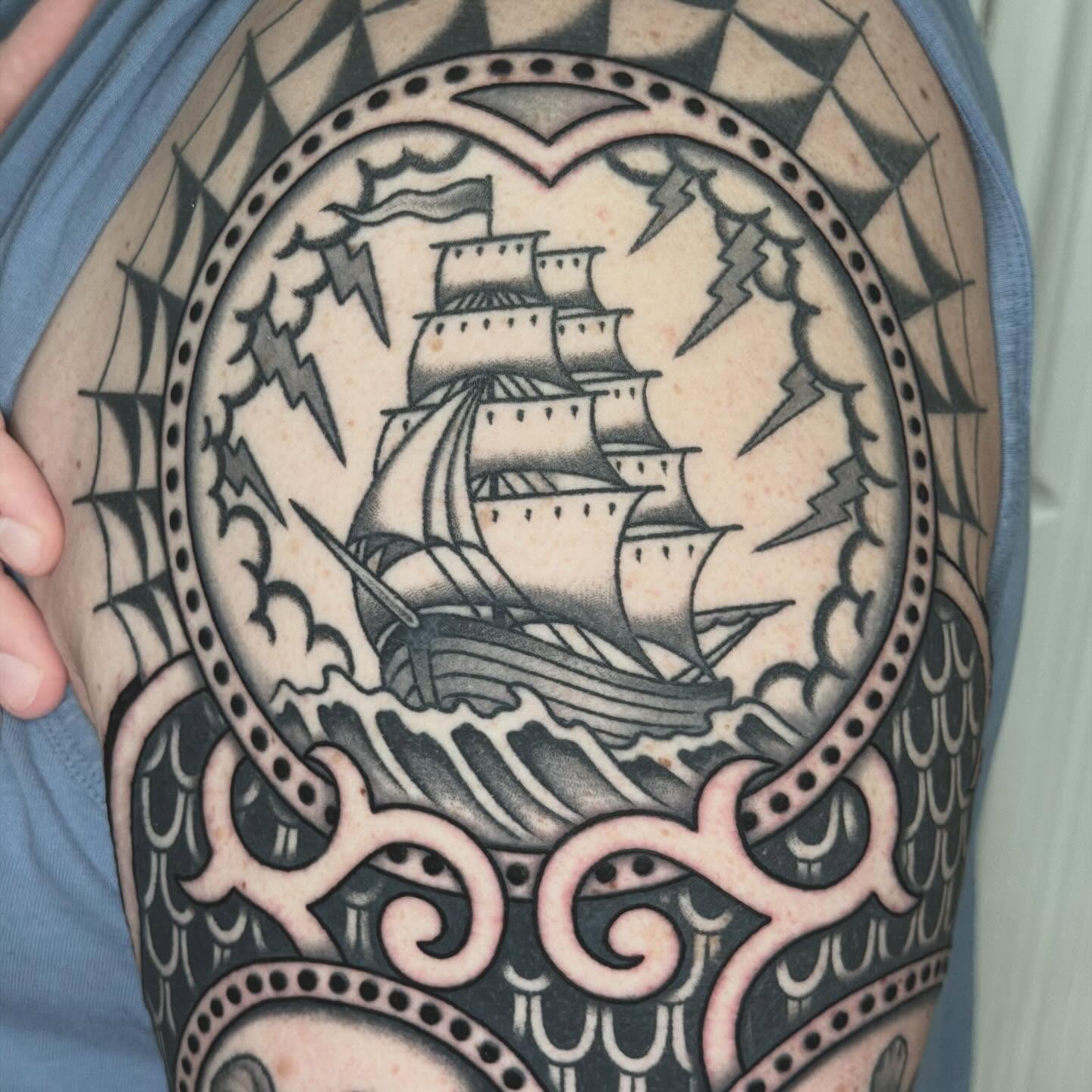 Ship in storm American traditional tattoo on the upper arm by Michael Barnhill Tattooer, Charlotte, North Carolina