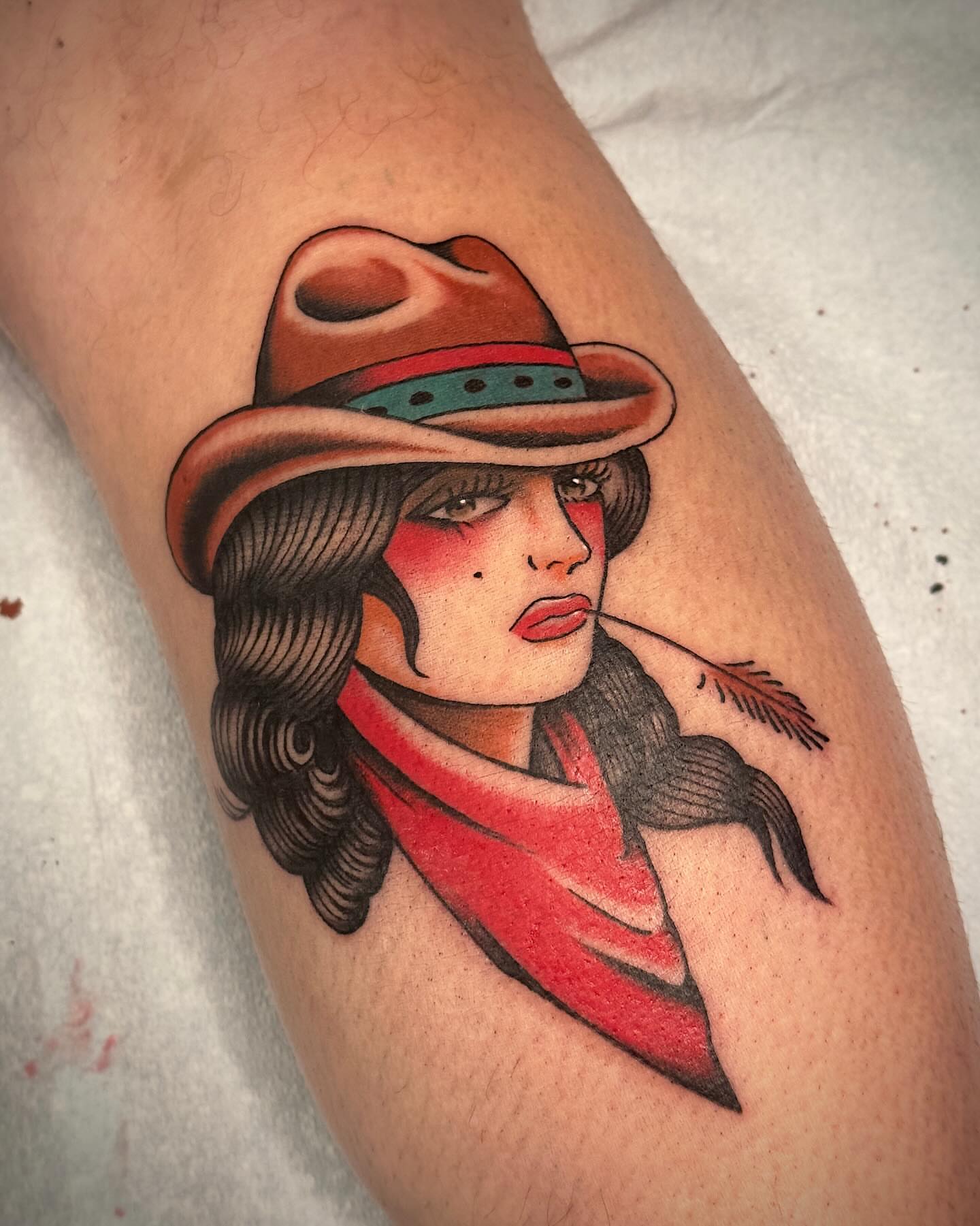 Woman wearing hat American traditional tattoo on the forearm by Craig Ryans